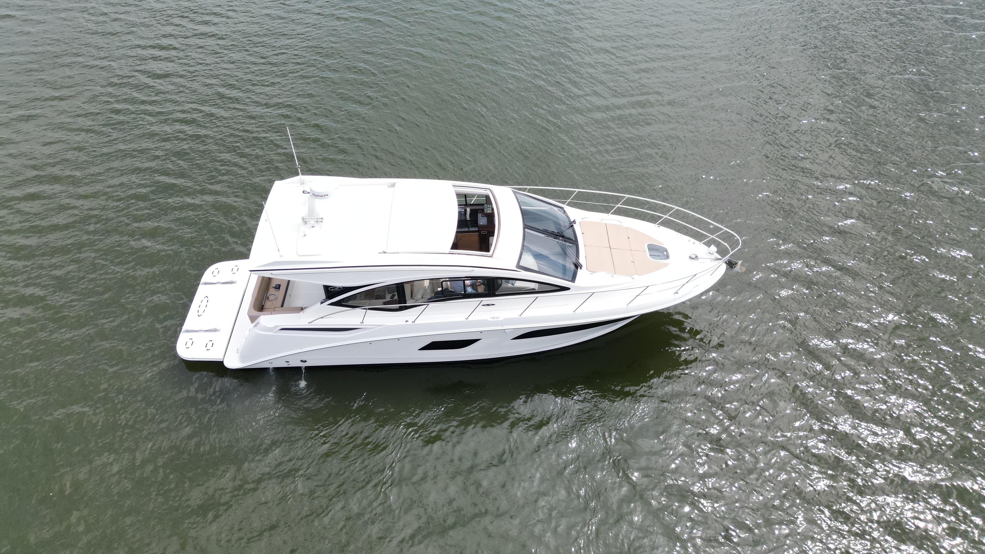 2017 Sea Ray Sundancer 400 yacht on open water, aerial view.