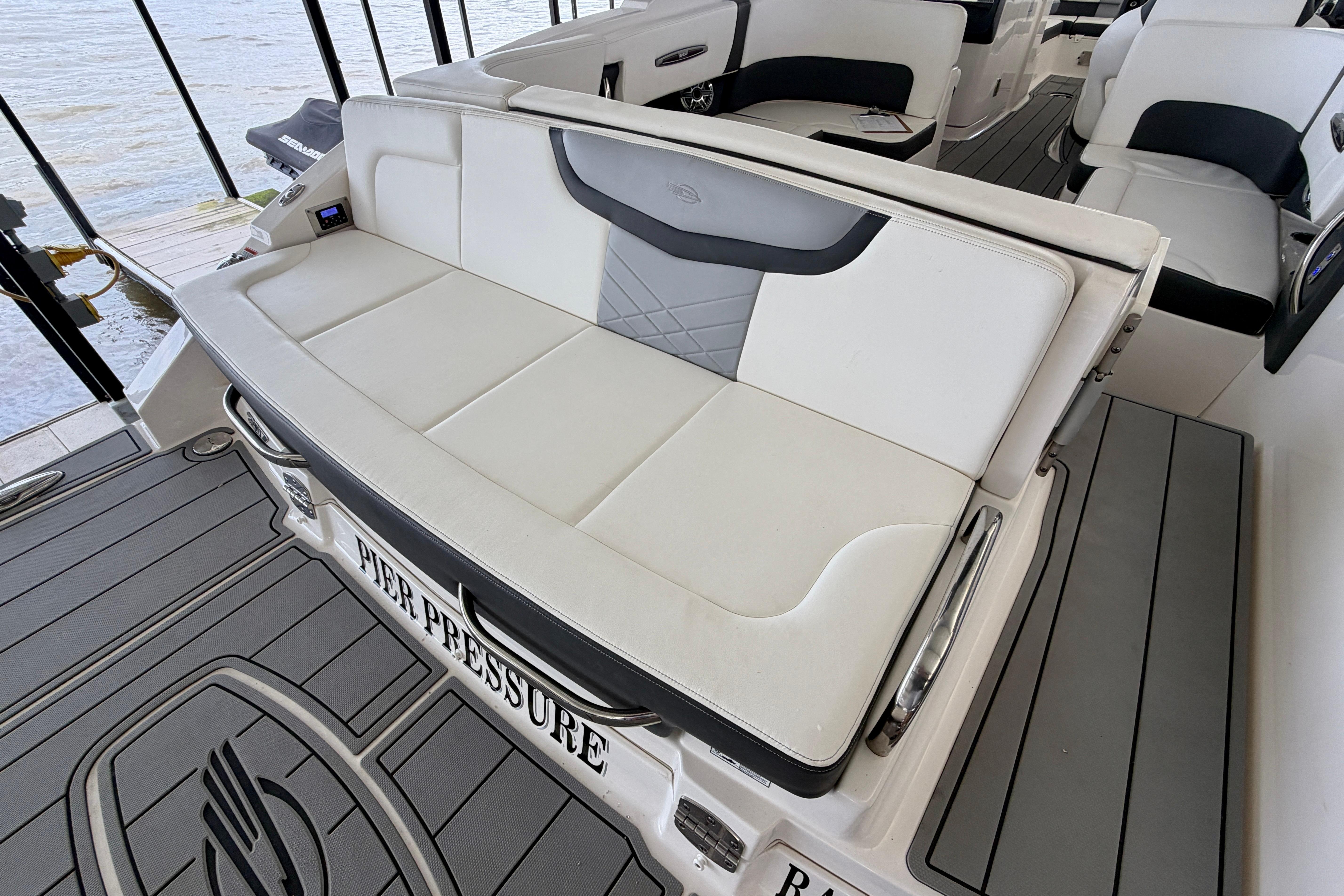 2022 Chaparral 317 SSX boat interior with white seating and custom flooring.