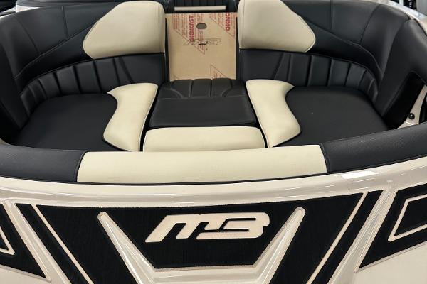 2024 MB F22 Tomcat boat interior with black and white seating.