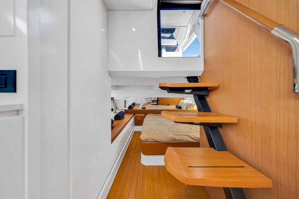 Interior of 2021 Bluegame BG 42 yacht with modern wooden stairs and cozy cabin.