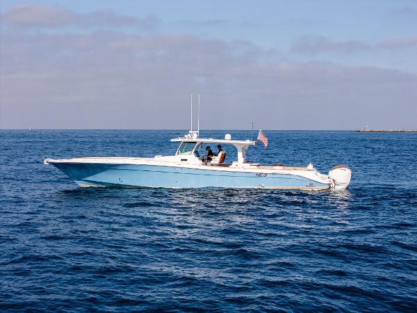 2020 HCB 53 Sueños boat cruising on open water under a clear sky.