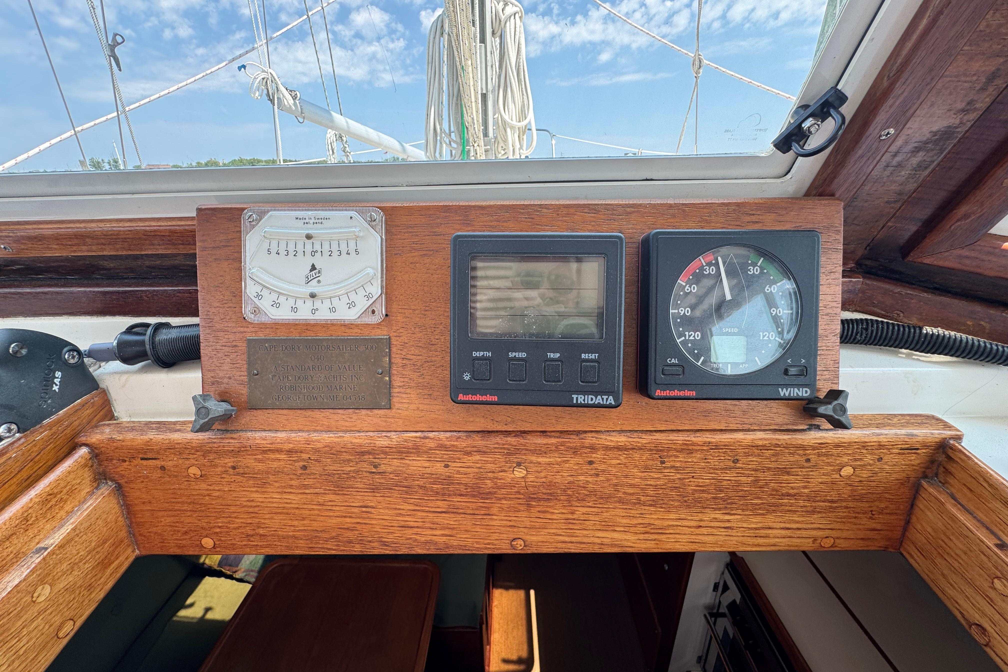 Control panel of a 1989 Cape Dory 30 Motorsailer with navigation instruments.