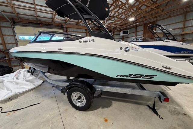 2026 Yamaha Boats AR195 in a storage facility, showcasing sleek design and modern features.