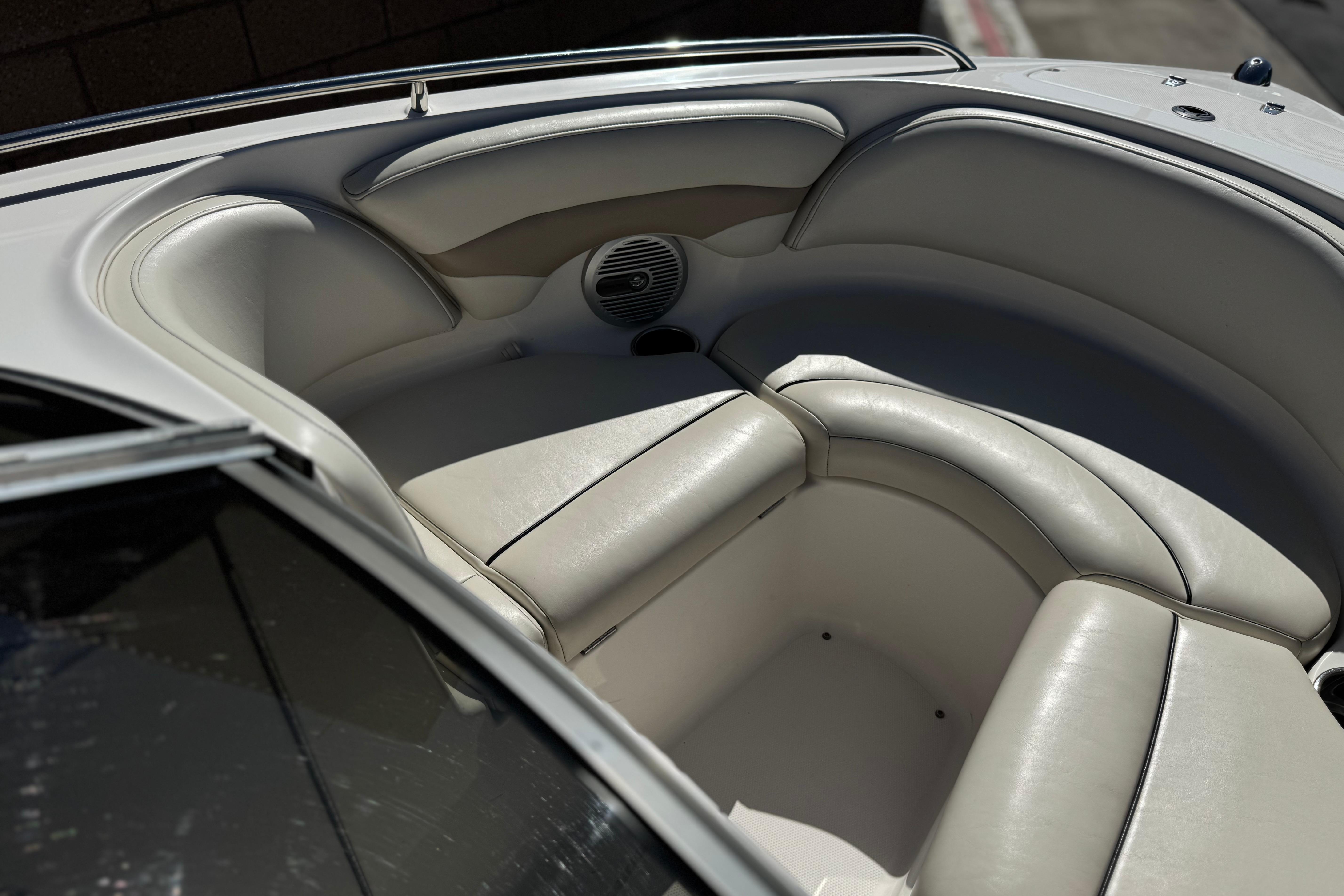 Interior seating of a 2002 Chaparral 186 SSi boat, featuring white cushioned seats.