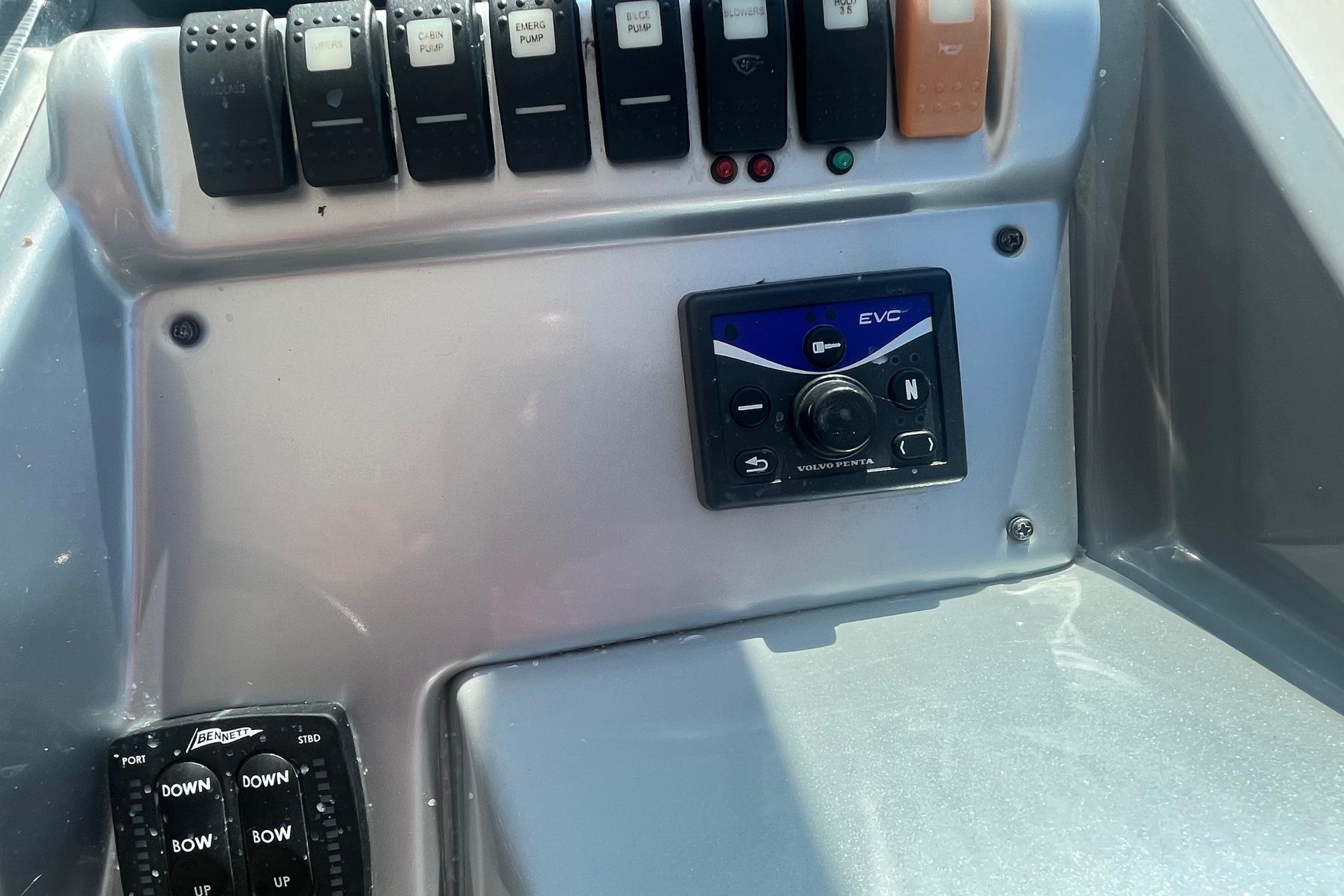 Control panel of a 2010 Monterey 400 Sport Yacht with switches and EVC system.