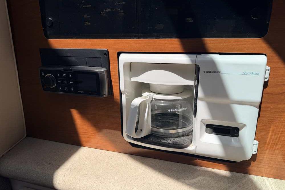 Built-in coffee maker and stereo system in 2001 Monterey 282 Cruiser cabin.
