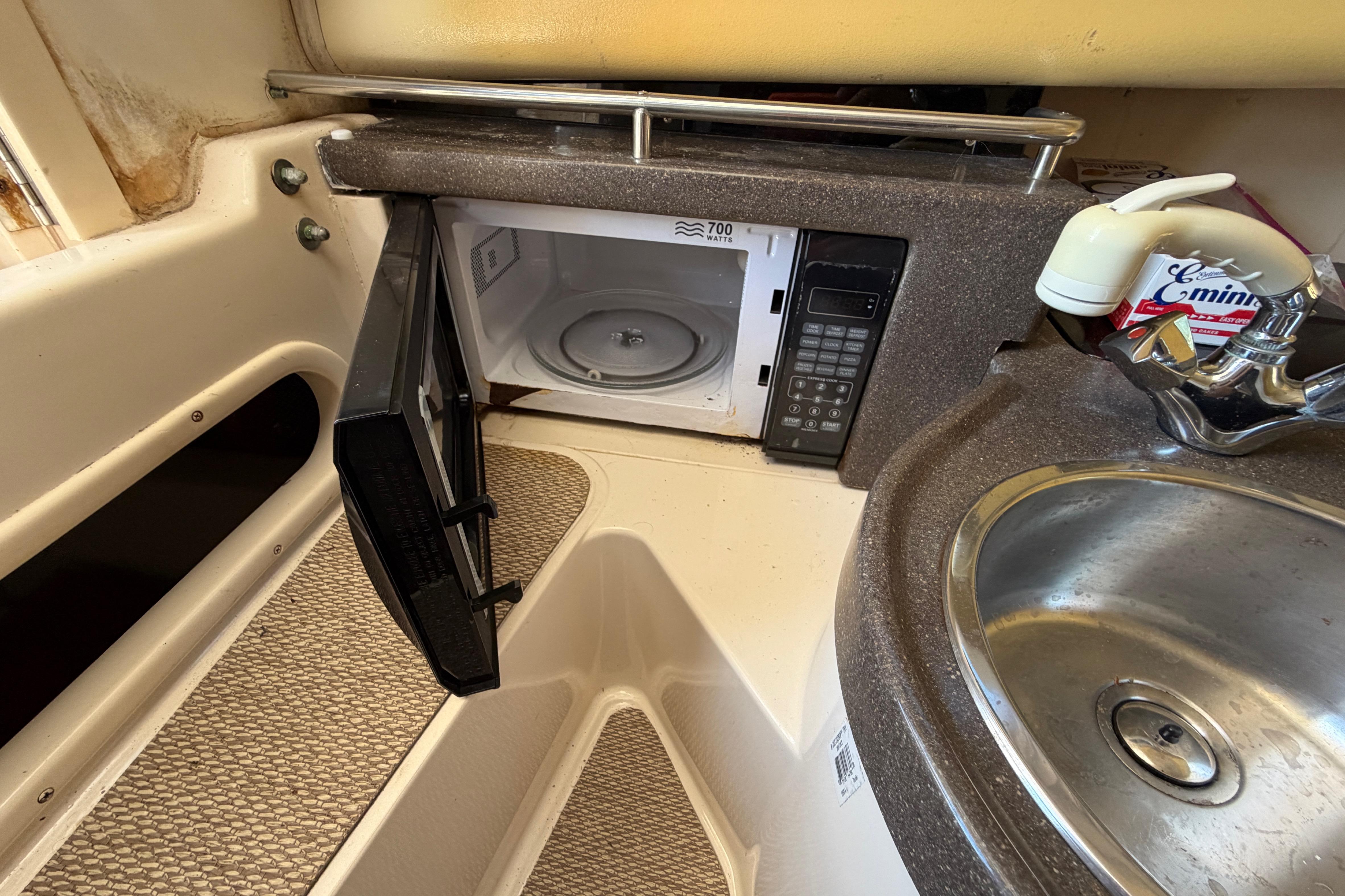 2006 Grady-White Sailfish 282 interior with microwave and sink.