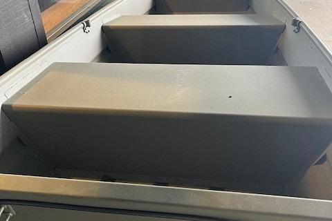 2026 Tracker Grizzly 10 Jon boat interior with bench seating, showcasing durable construction.