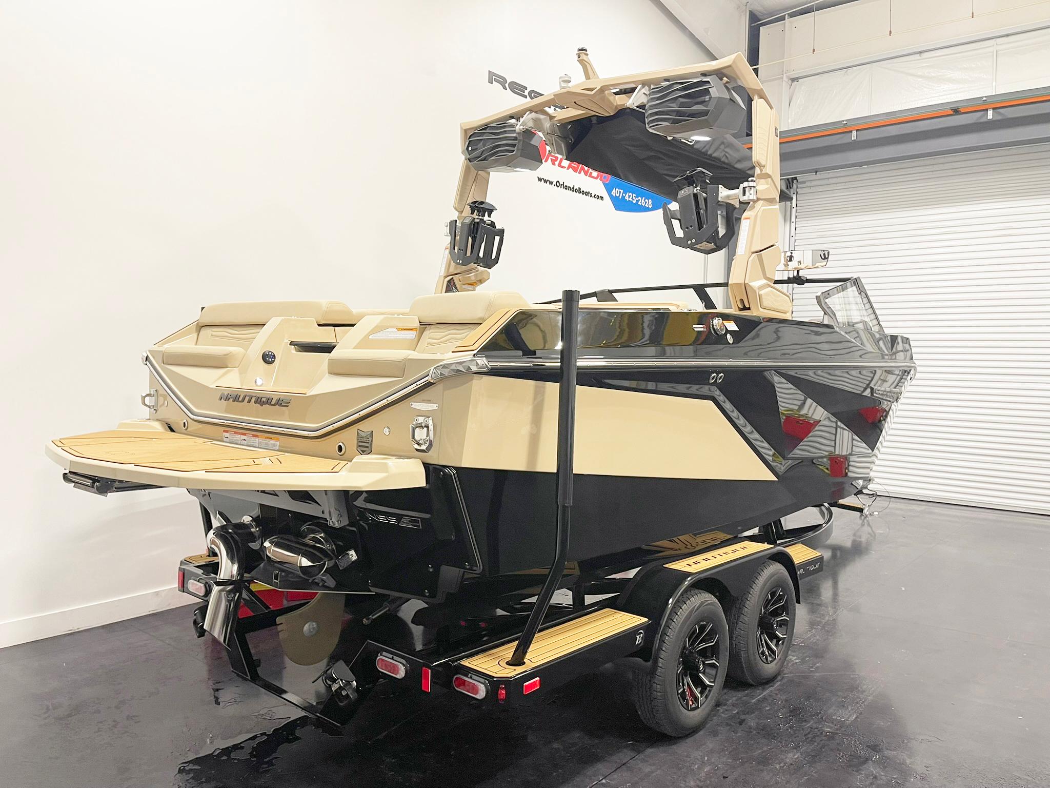 2025 Nautique Super Air Nautique G25 boat on trailer in showroom.