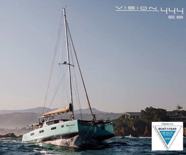 Sailing yacht Vision 444 cruising near rocky coastline, 2026 model, awarded Boat of the Year 2024.