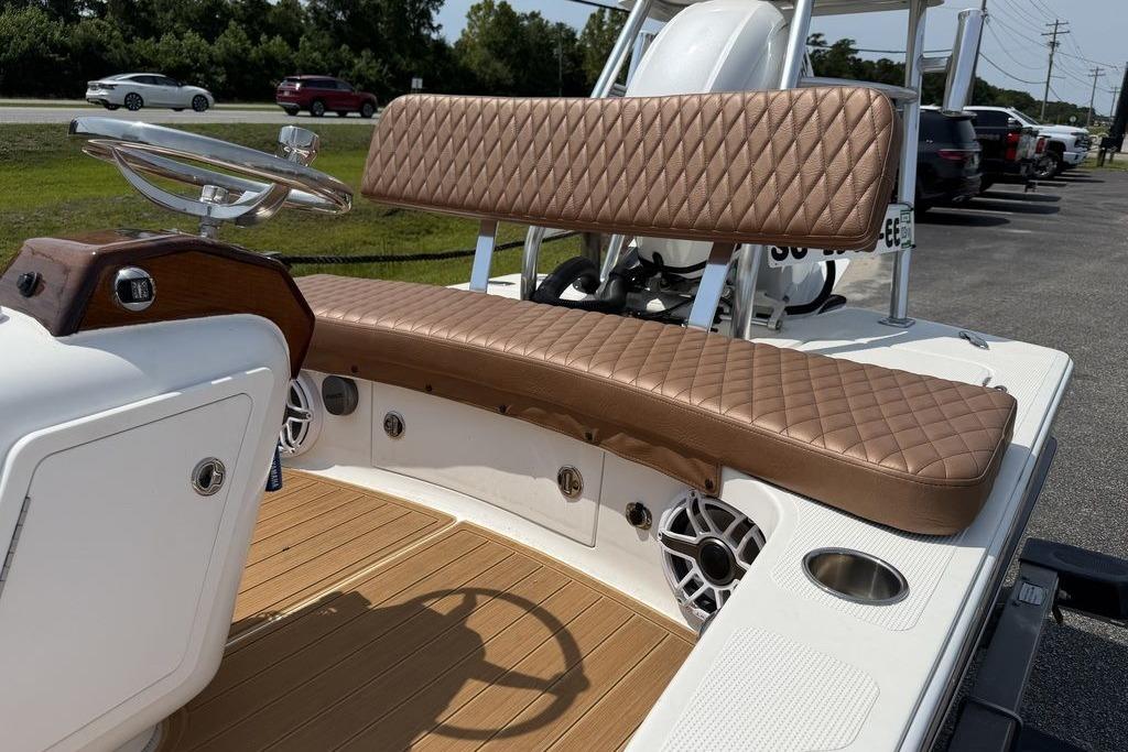 2012 Chaos 16 Bonefish boat interior with diamond-stitched seating and modern steering wheel.