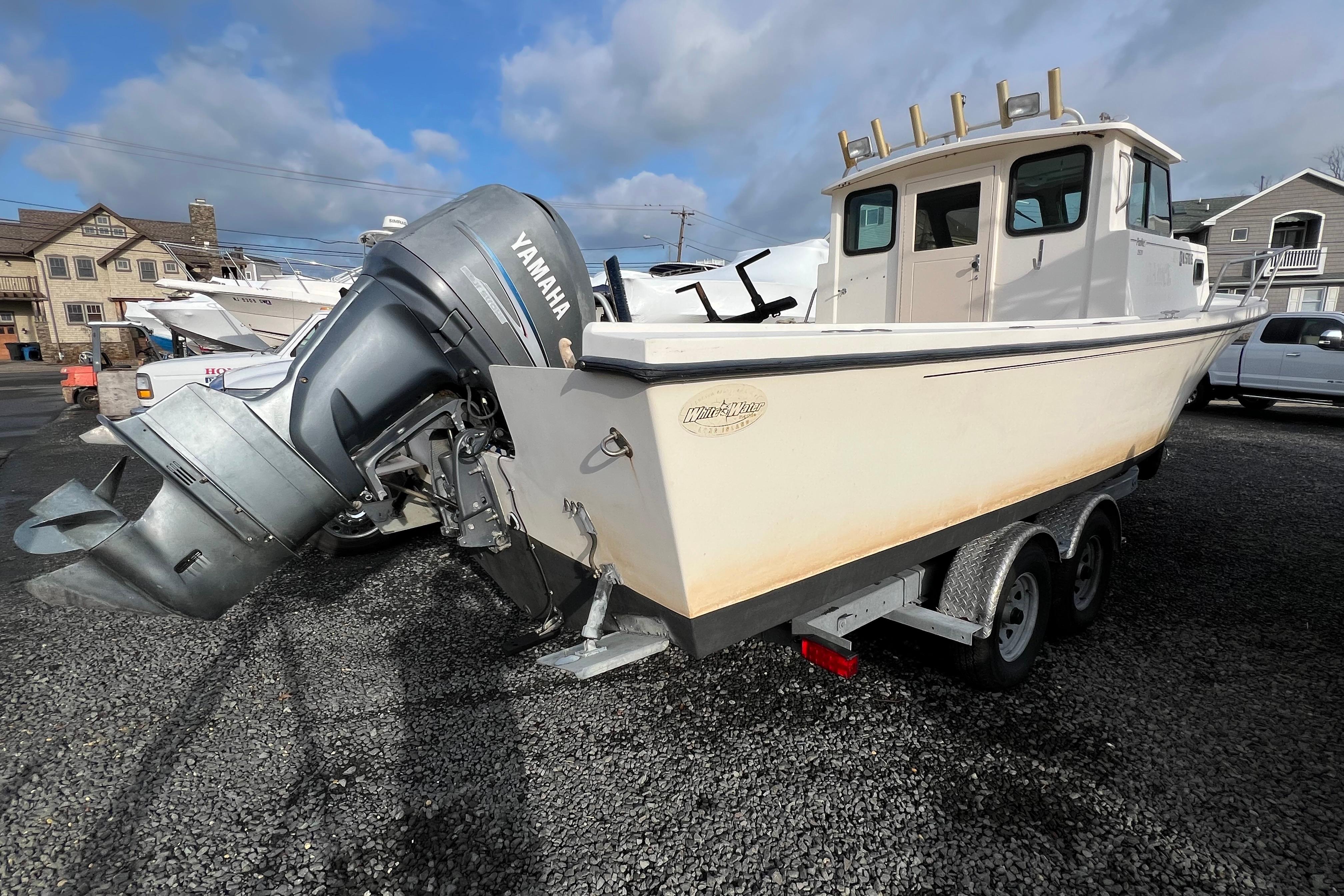 2001 Parker 2520 Deep Vee Sport Cabin boat with Yamaha outboard motor on trailer.