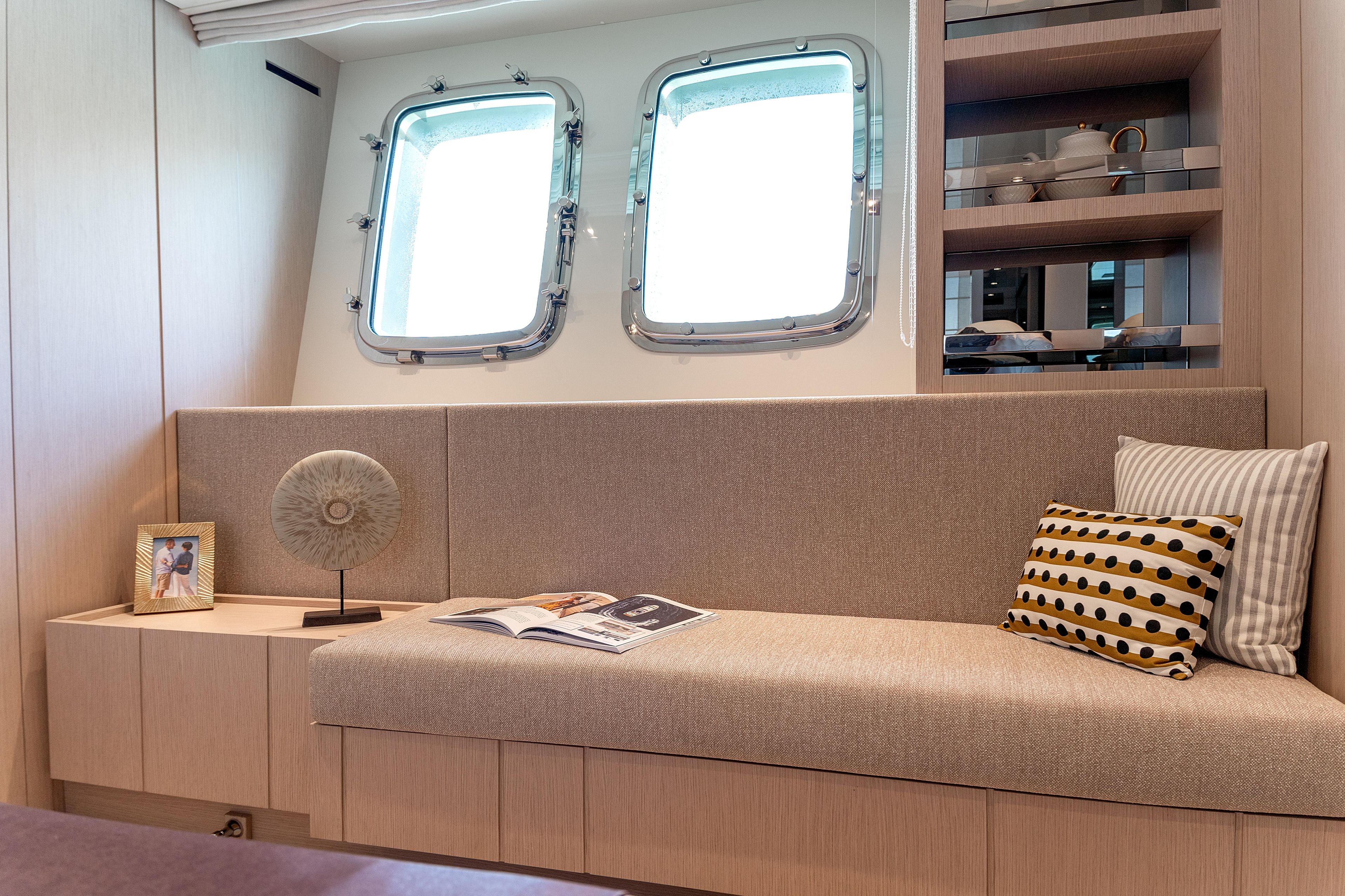 Luxurious interior of 2023 Sanlorenzo SX76 yacht with elegant seating and decor.