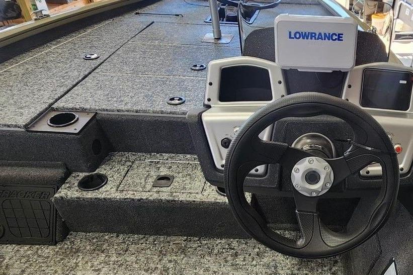 2026 Tracker Pro Team 195 boat interior with steering wheel and Lowrance electronics.