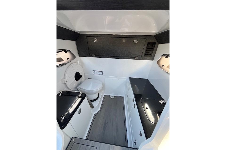 2026 Monterey Elite 27 SD boat interior with modern bathroom amenities.
