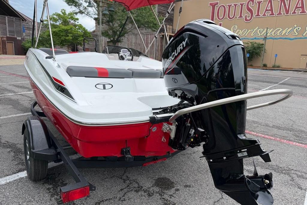 2026 Tahoe T16 boat with Mercury engine, parked outdoors.