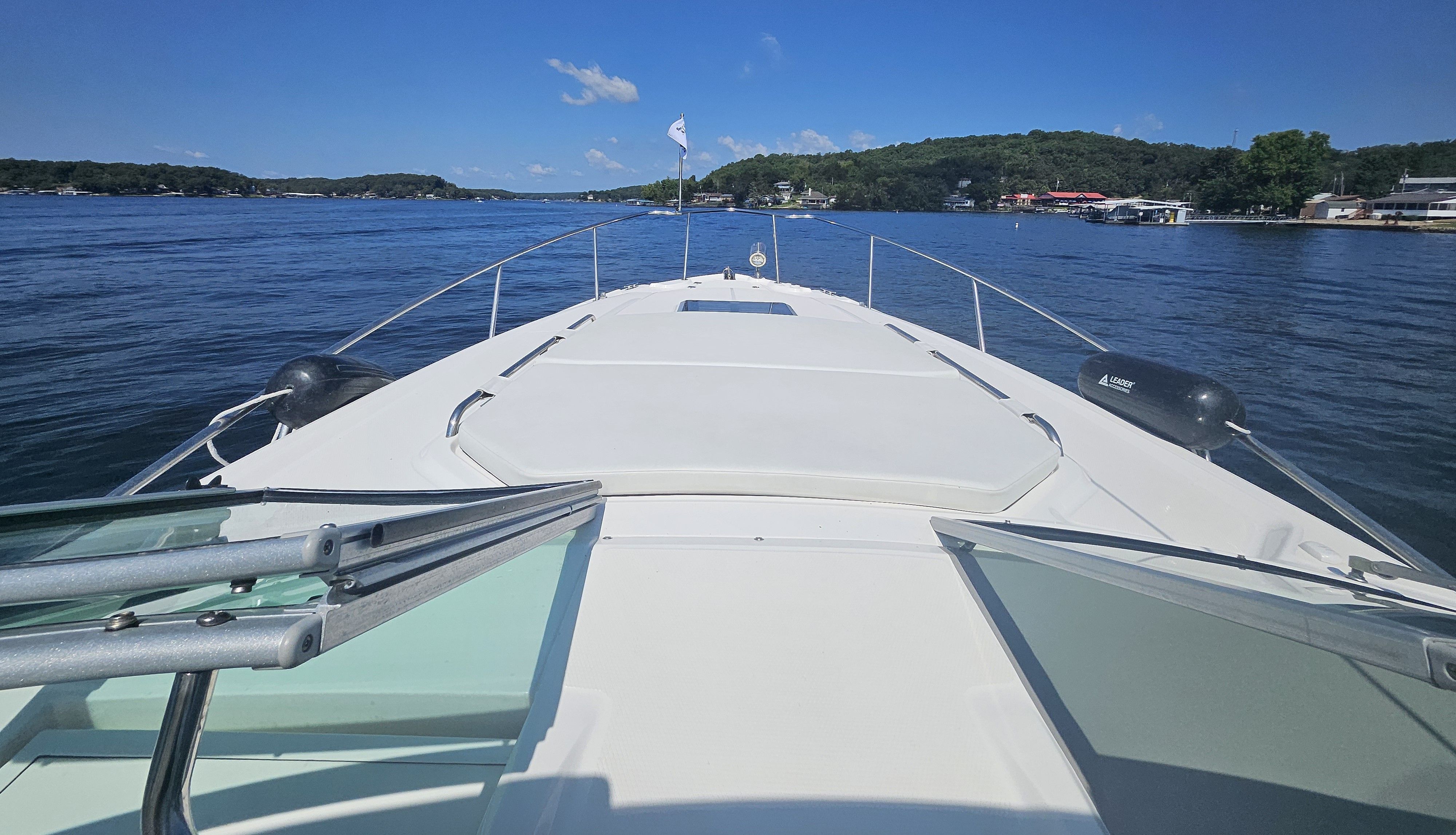 Chaparral 330 Signature 2014 on a serene lake.
