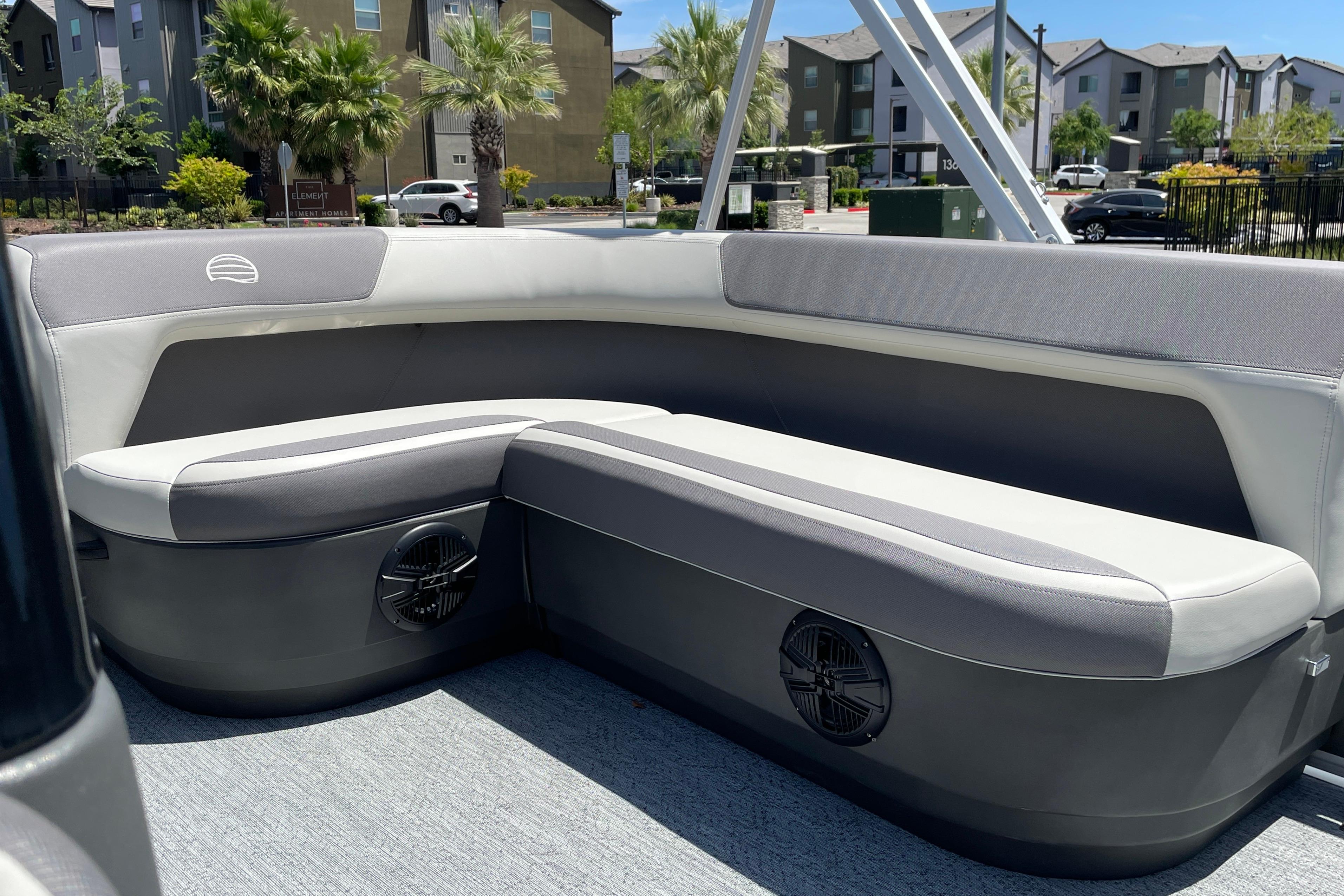 2026 Sun Tracker Bass Buggy 16 XL Select interior with gray seating and speaker system.