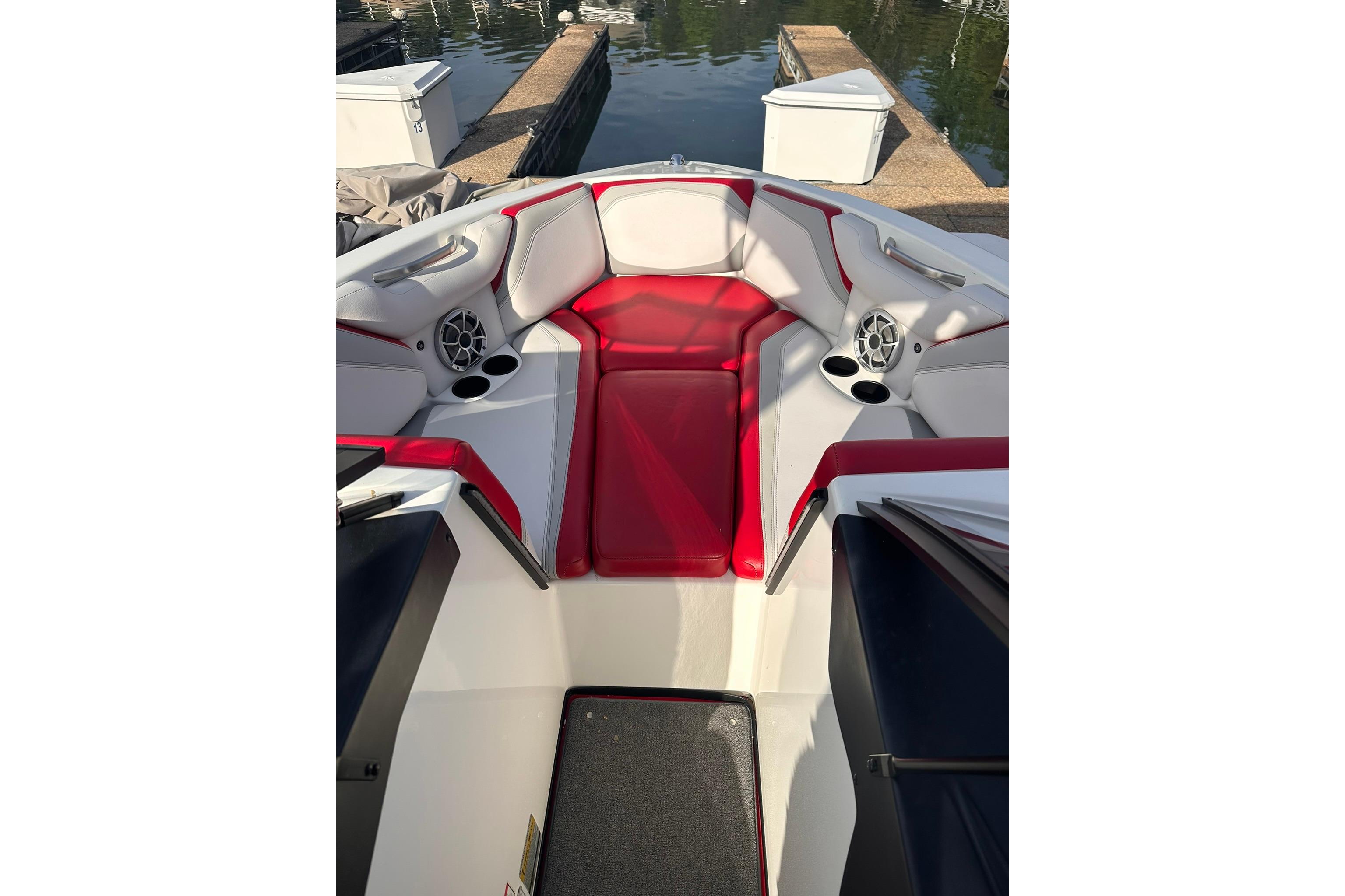 2017 Axis T23 boat interior with red and white seating, cup holders, and speakers.