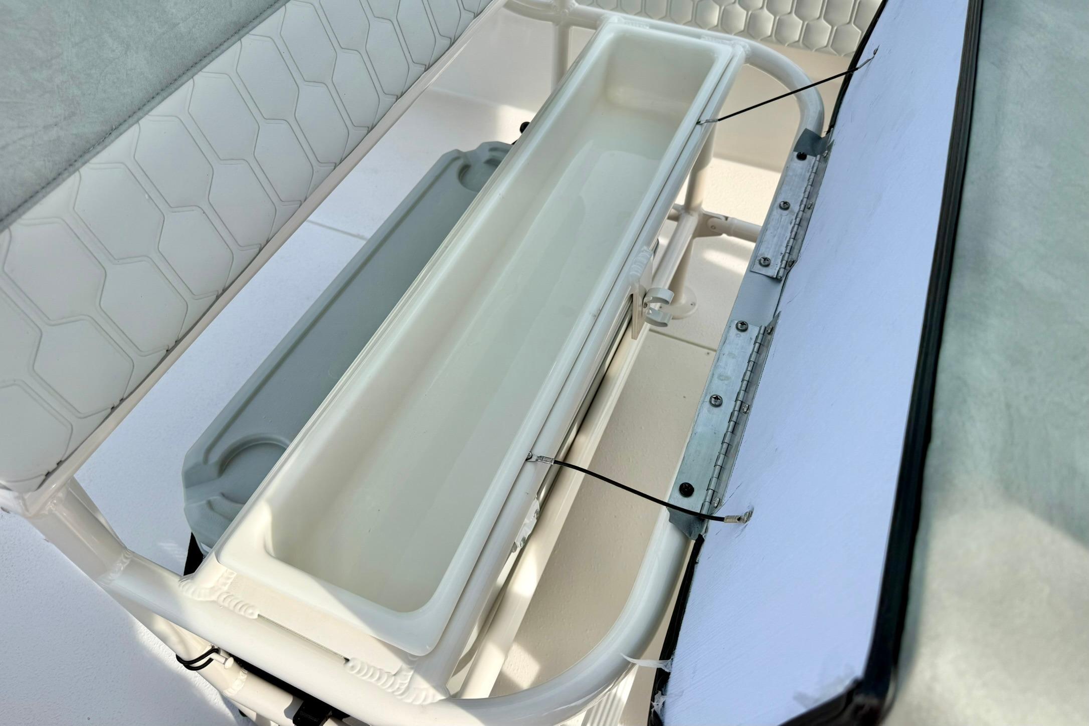 2026 Carolina Skiff 24 Ultra Elite boat interior storage compartment detail.