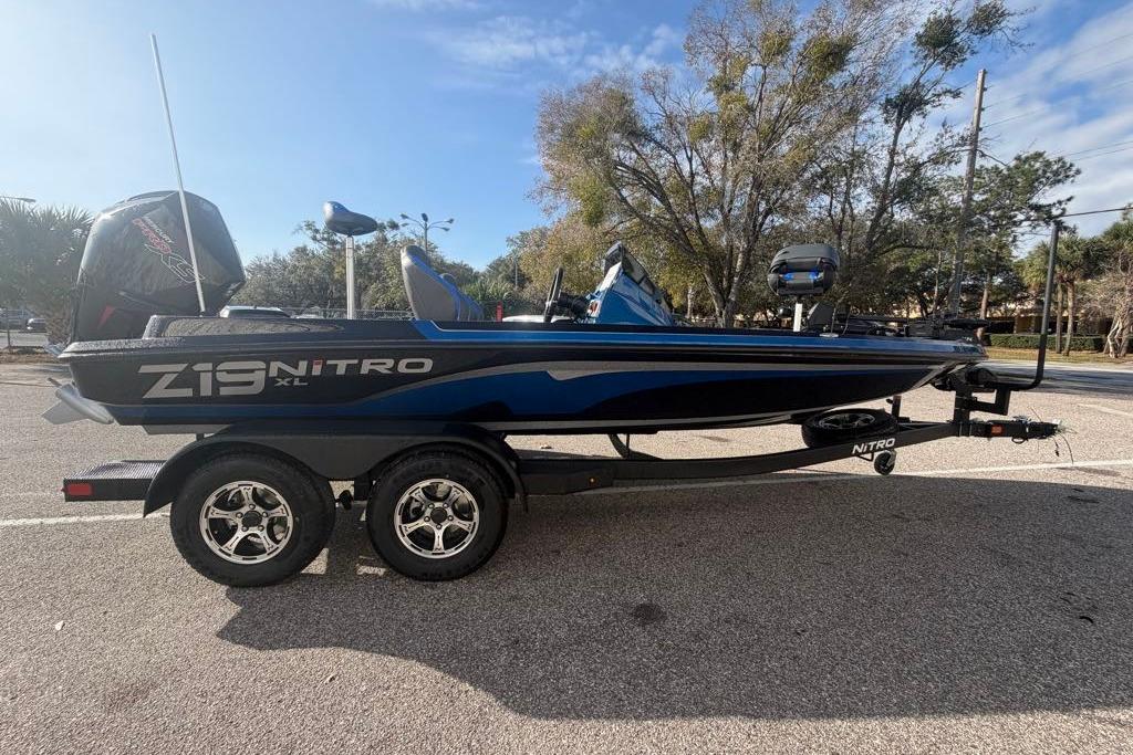 2026 Nitro Z19 XL Pro boat on trailer, parked outdoors, side view.