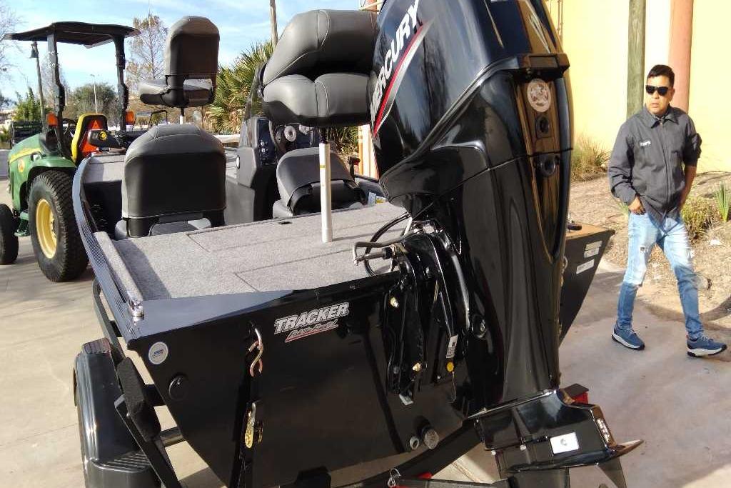 2026 Tracker Bass Tracker Classic XL boat with Mercury engine on display.