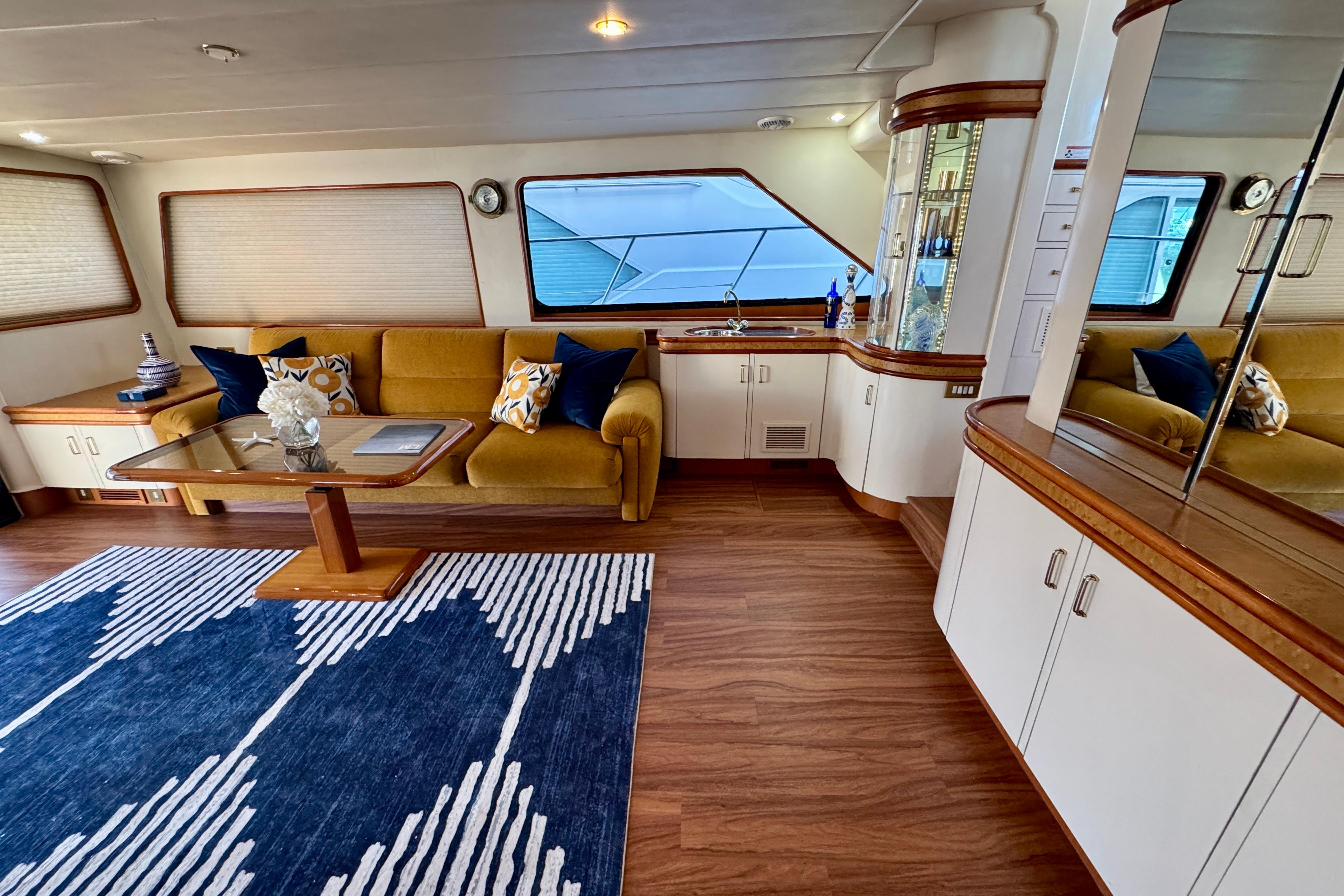 Luxurious interior of 1995 Queenship 62 Pilothouse Motor Yacht with elegant seating and decor.