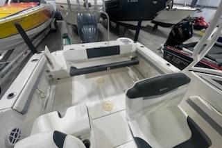 2022 Robalo R247 Dual Console boat interior with seating and storage.