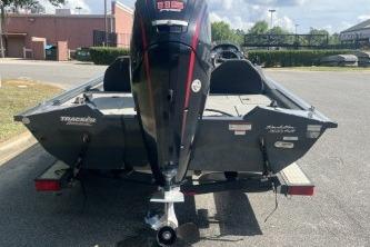 2019 Tracker Pro Team 190 TX boat on trailer, rear view in parking lot.