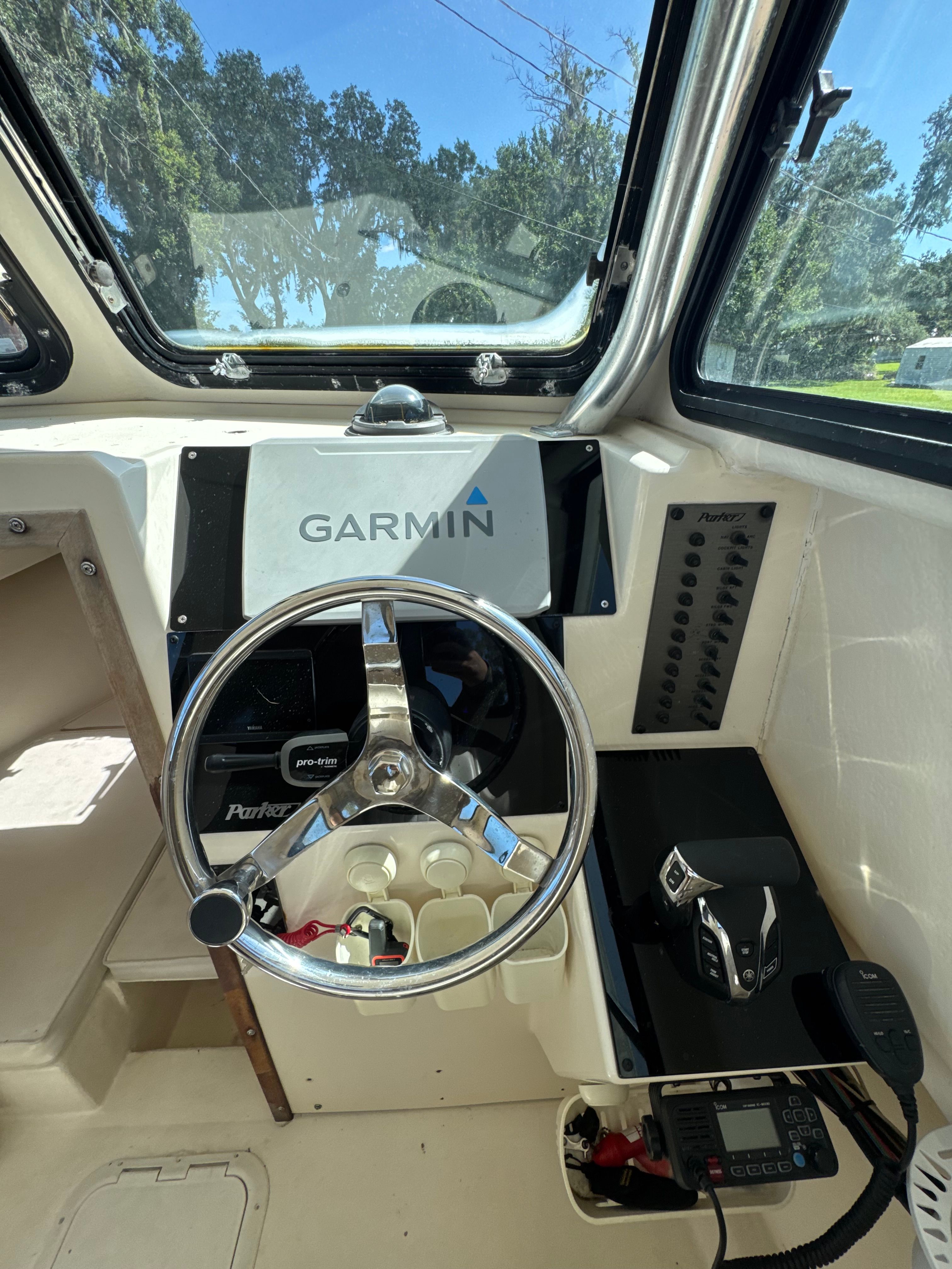Interior of a Parker 2520 boat with Garmin controls.