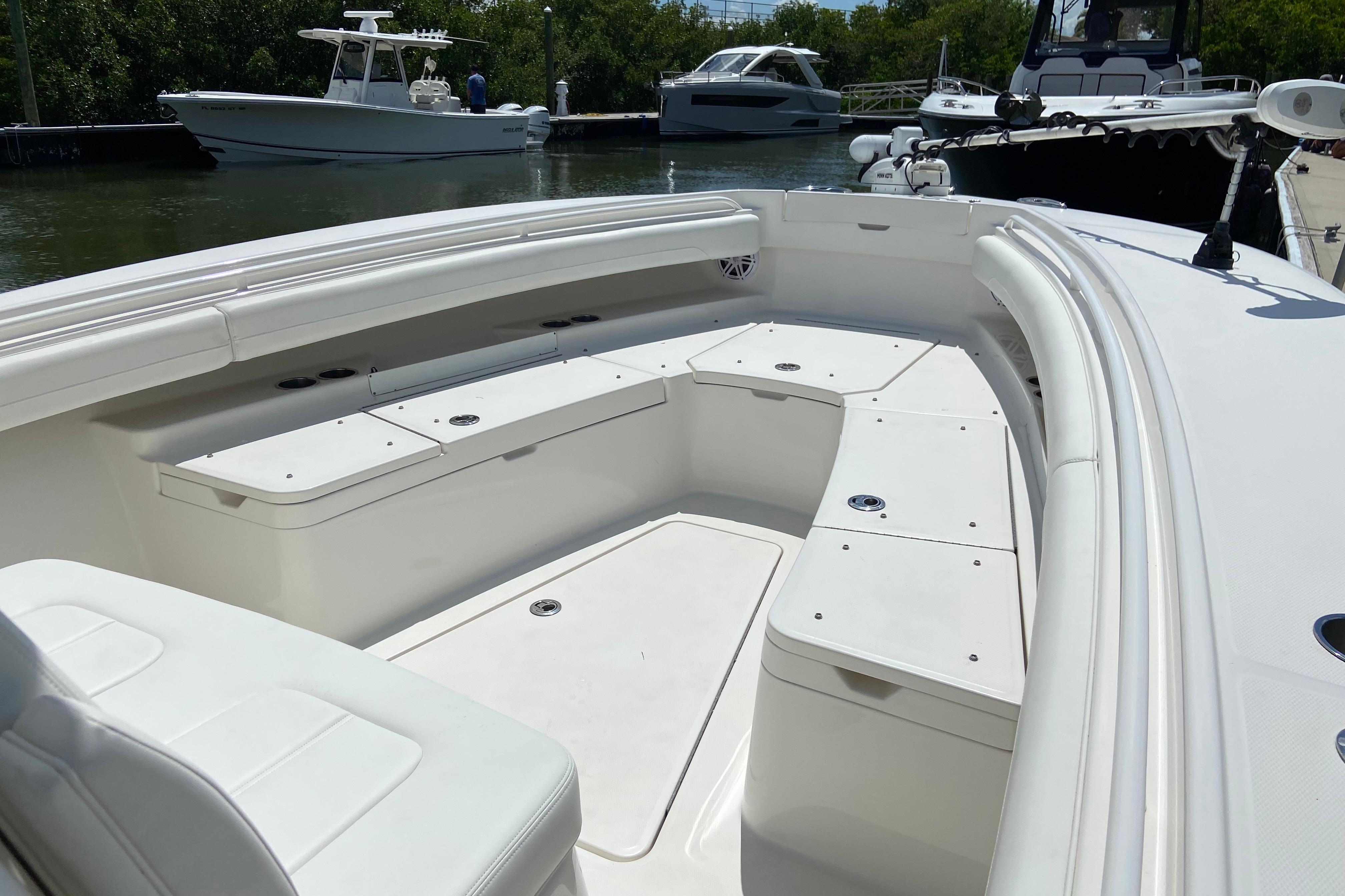 2021 Regulator 28 boat interior with spacious seating and sleek design in a marina setting.