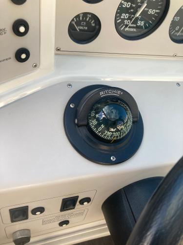 Compass and instruments on 1992 Regal Valanti 200 boat.
