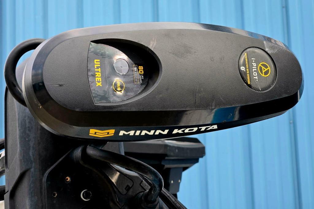 Minn Kota Ultrex trolling motor on 1996 Champion 181 SX boat, blue background.