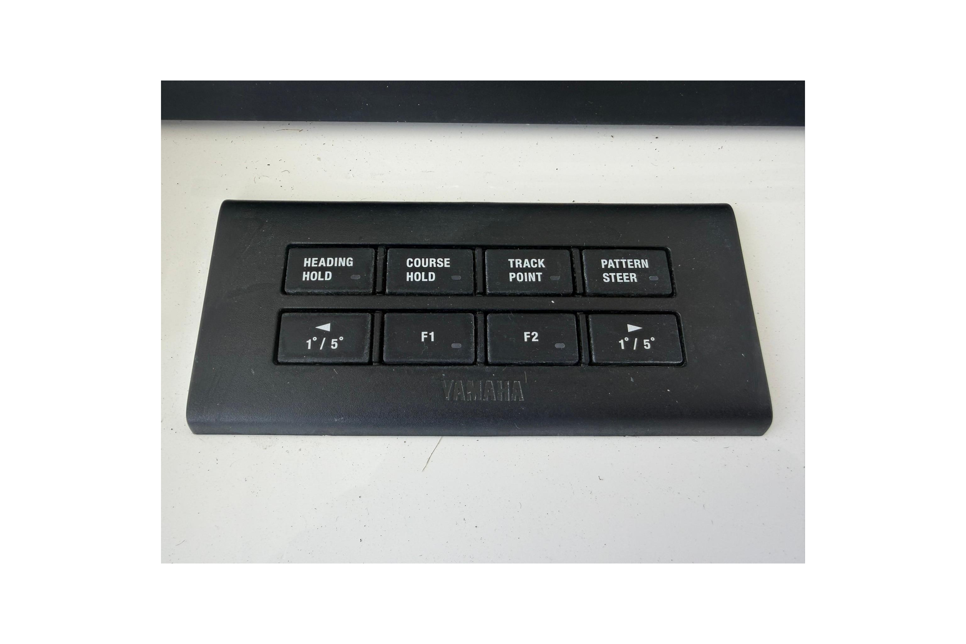Control panel with navigation buttons on a 2026 Regulator 37 boat.