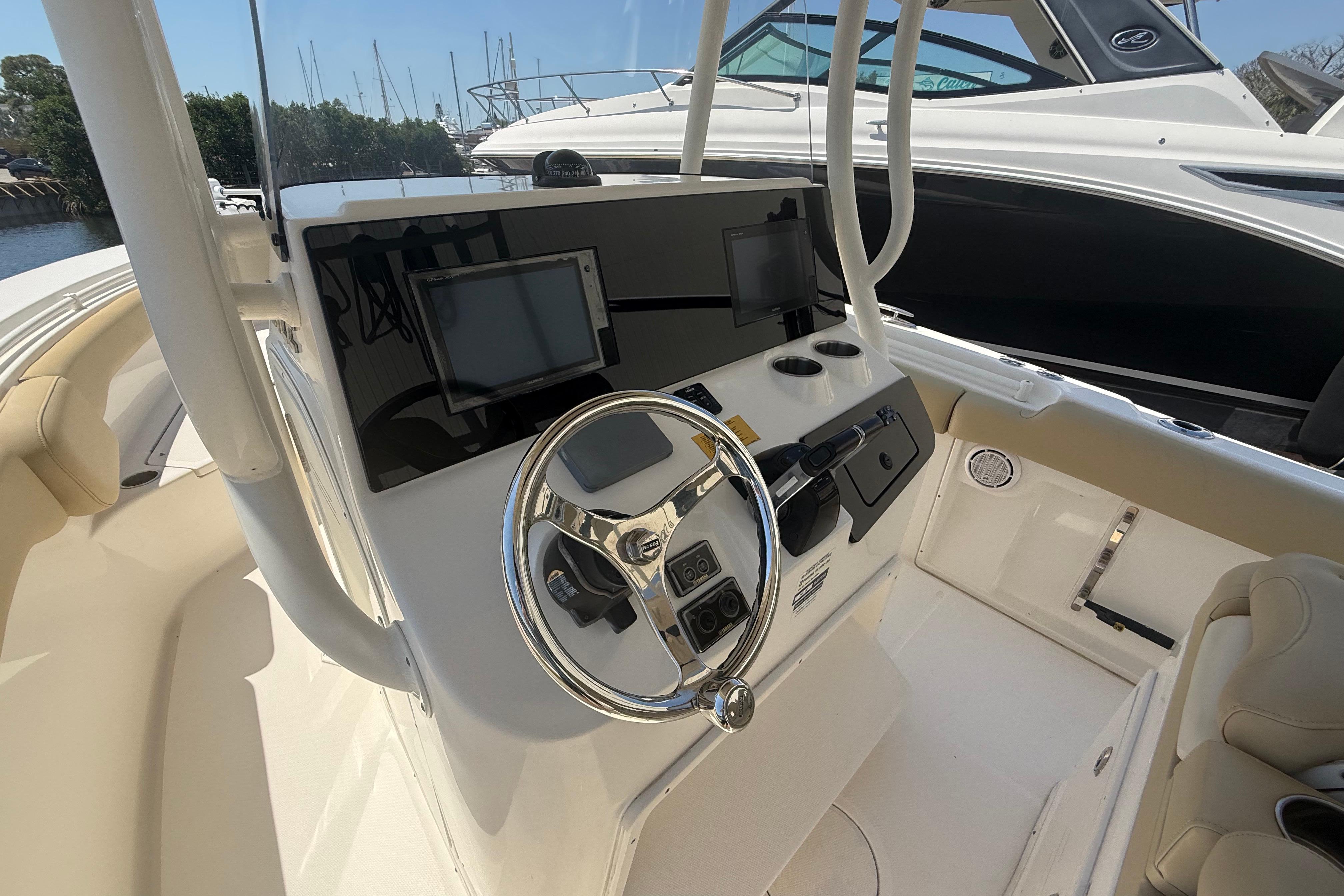 2019 Key West Billistic 281 Center Console helm with dual displays and steering wheel.