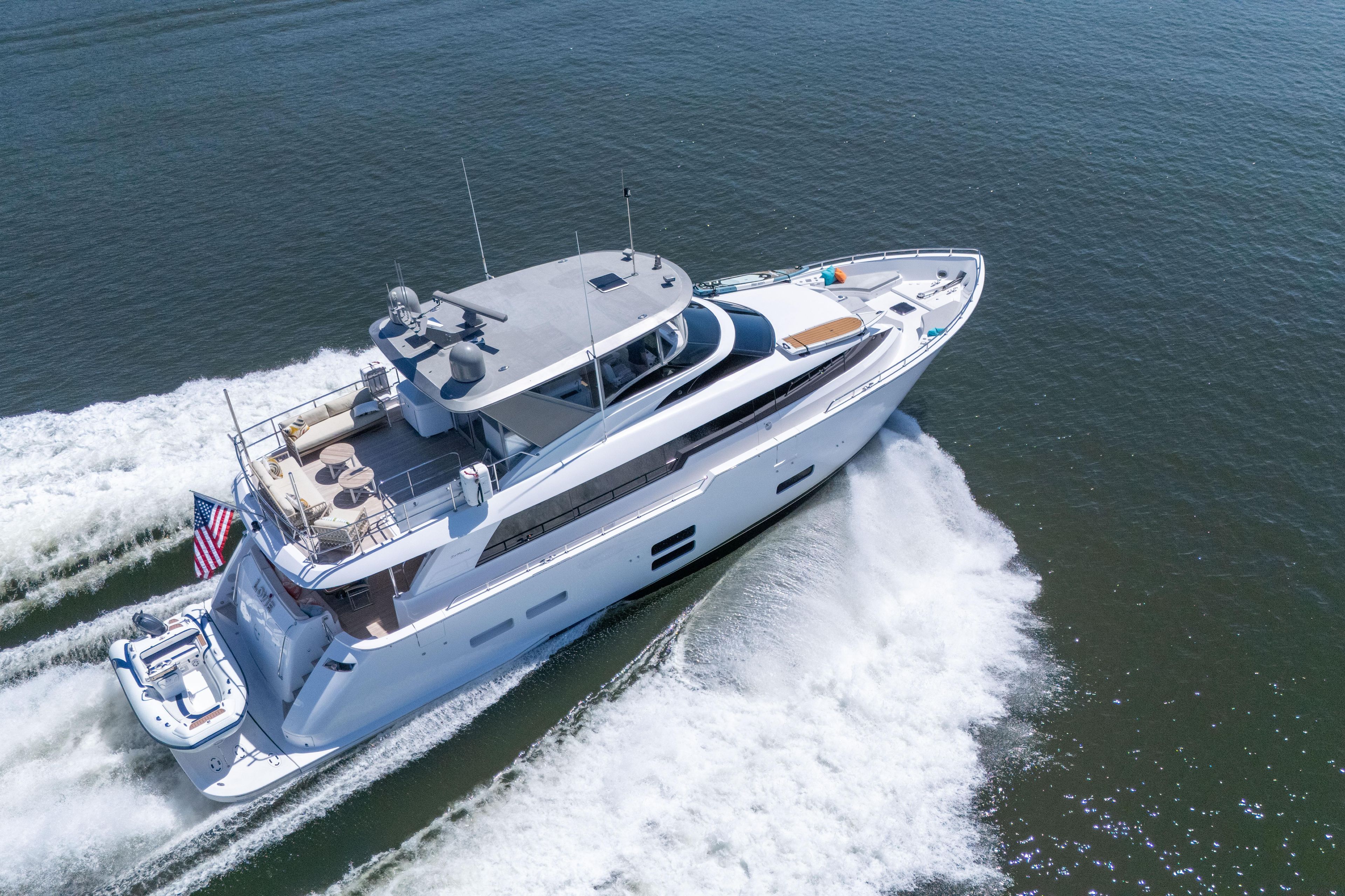2021 Hatteras M75 Panacera yacht cruising on open water.