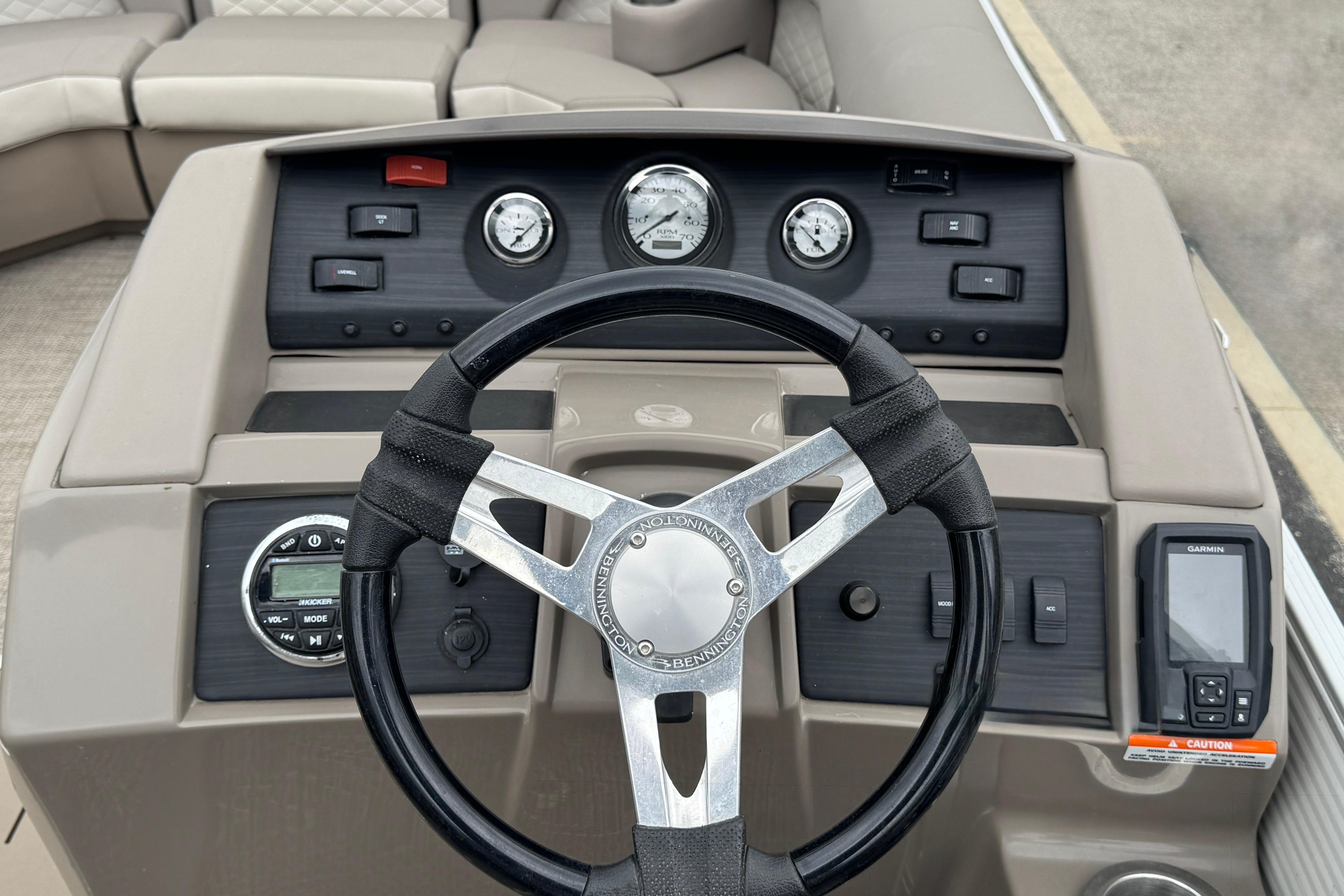 Dashboard of a 2019 Bennington SX 22 SSBXP boat with steering wheel and controls.
