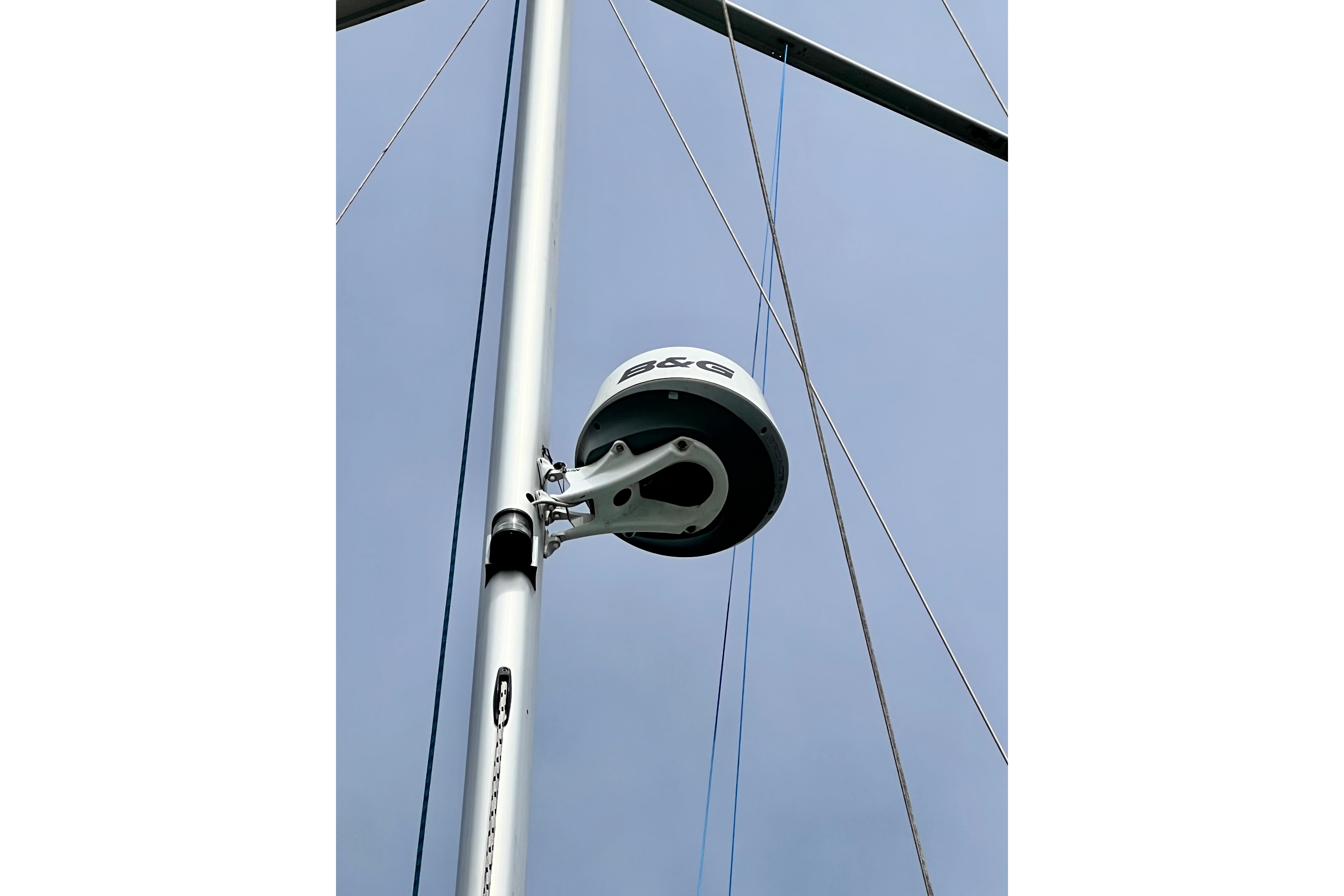 Radar equipment on a 2016 Hanse 455 sailboat mast against a clear sky.