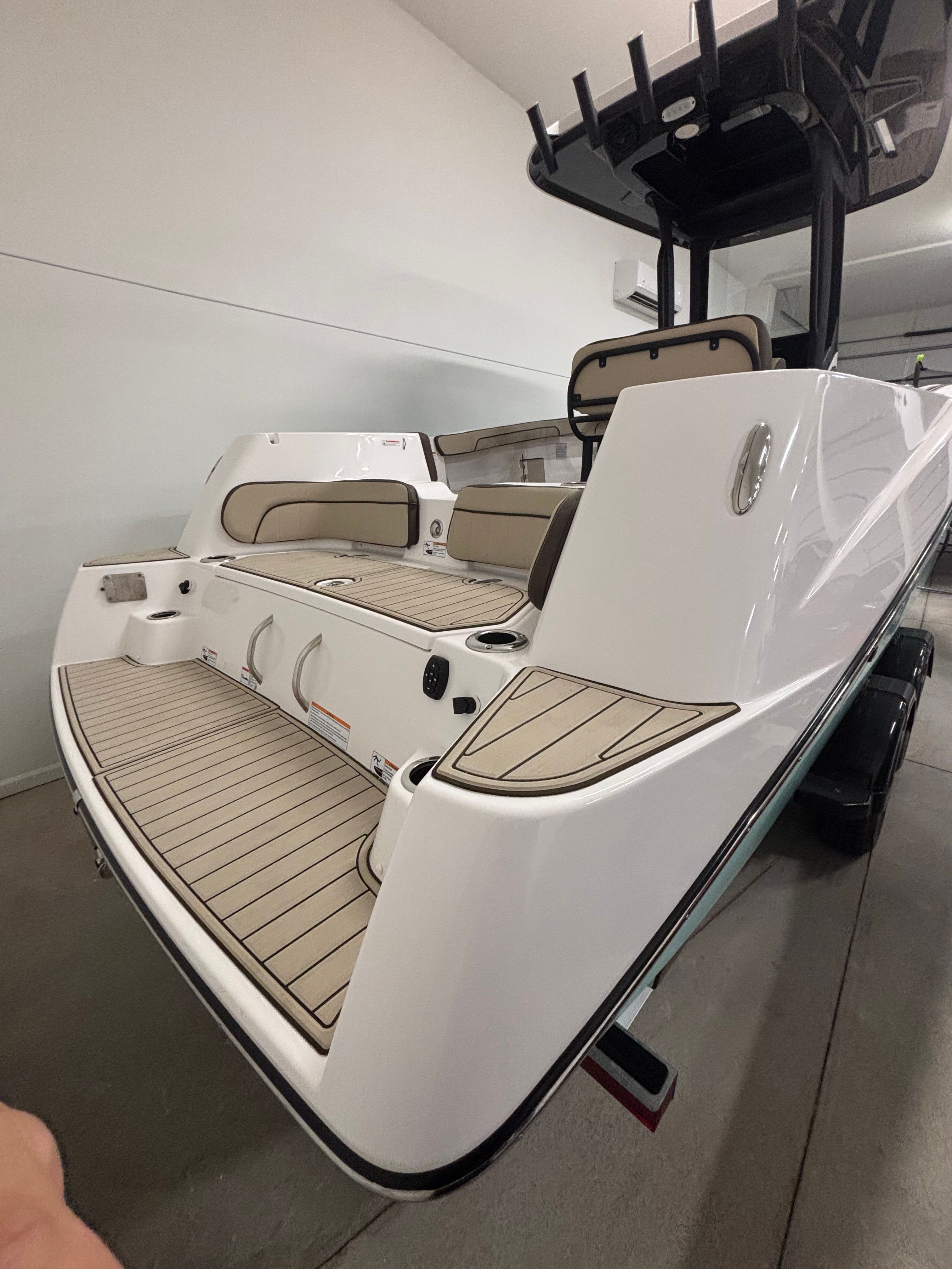 The image shows a modern Yamaha boat with sleek lines and a spacious deck.