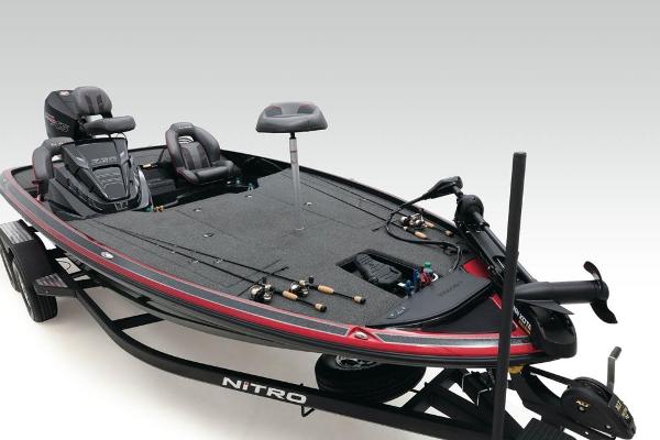 2022 Nitro Z20 fishing boat with seats and fishing rods on trailer.