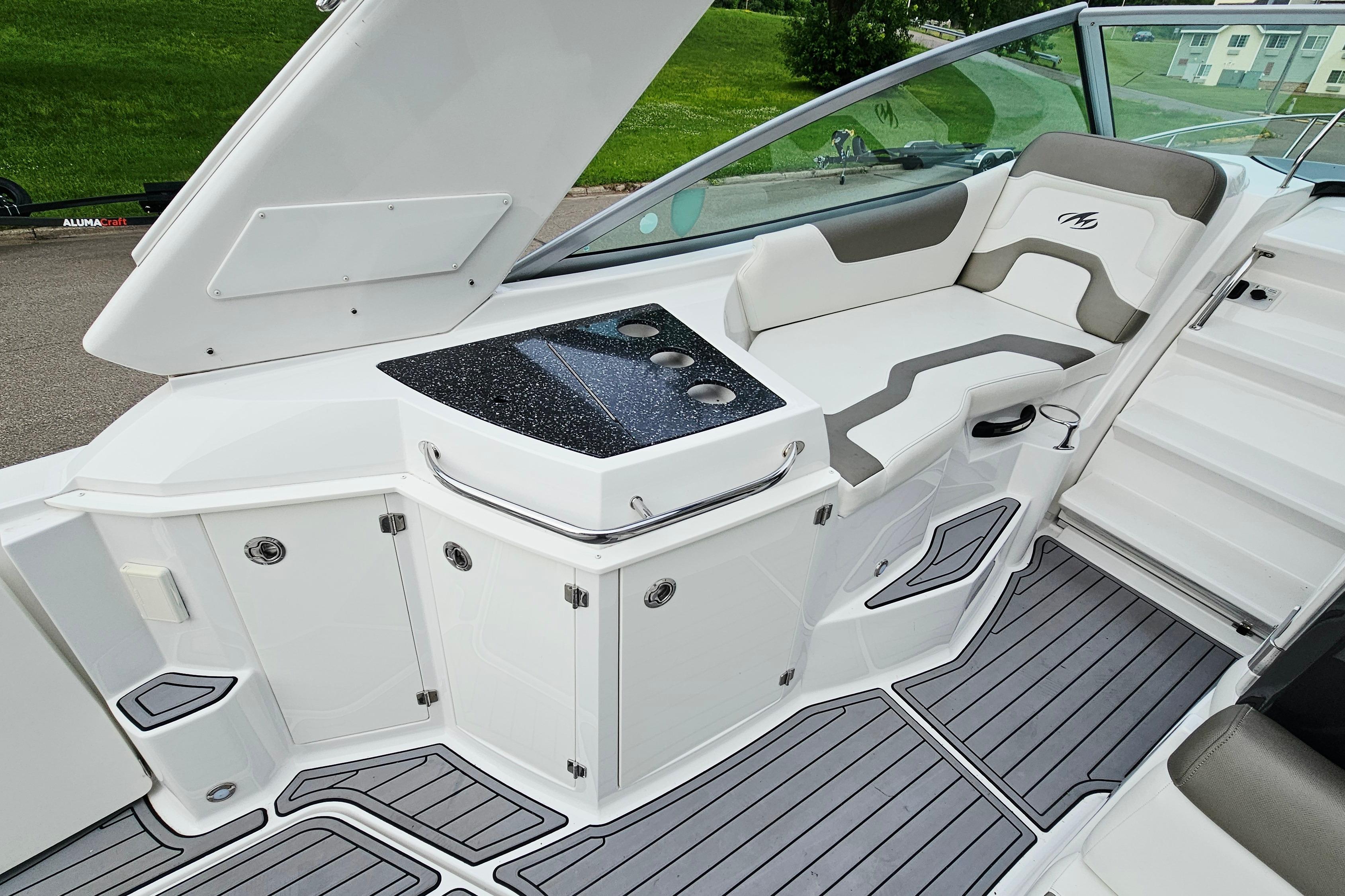 2016 Monterey 295 Sport Yacht interior with sleek seating and modern design.