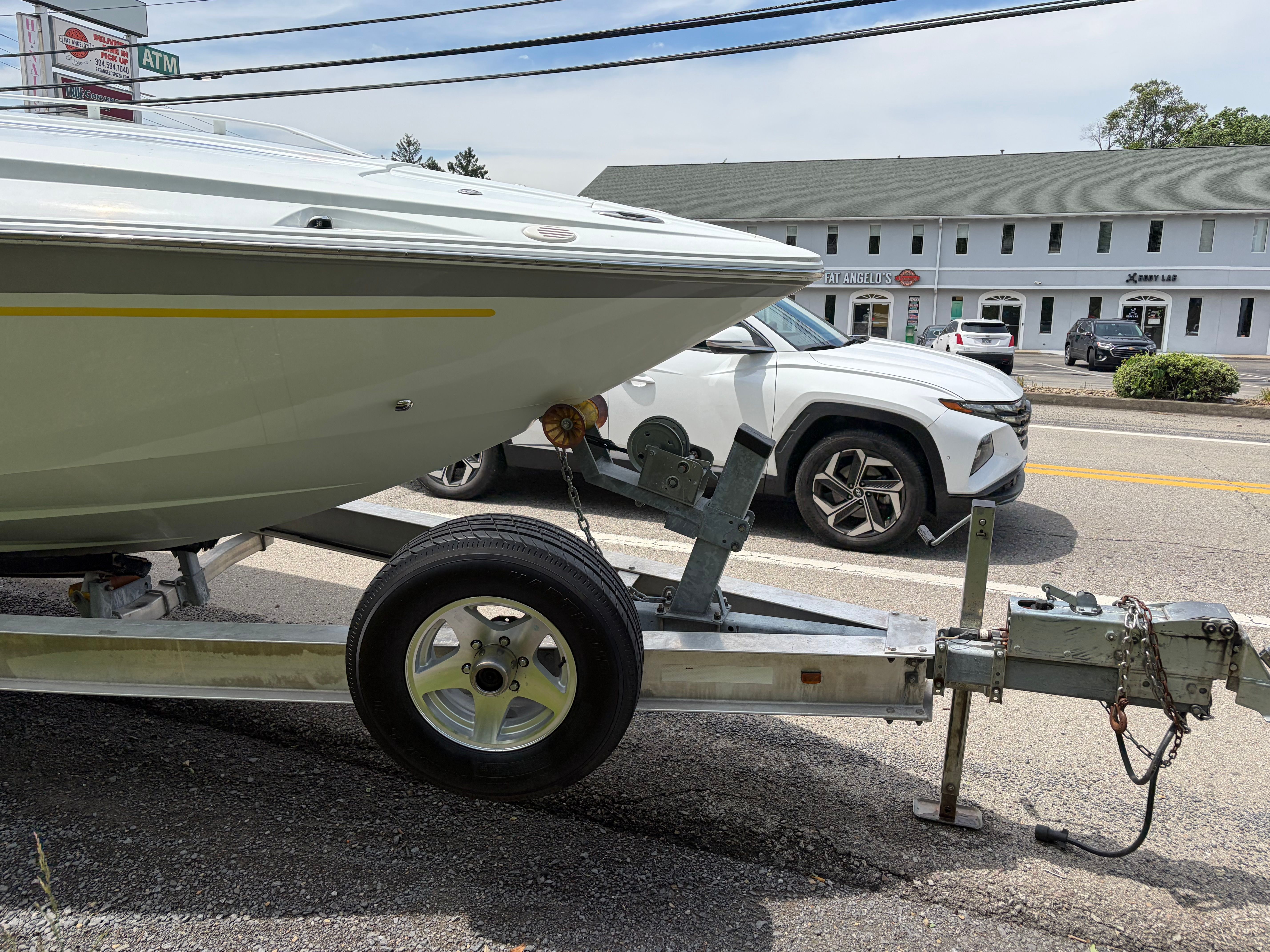 Baja 30 Outlaw 2007 on trailer beside road.