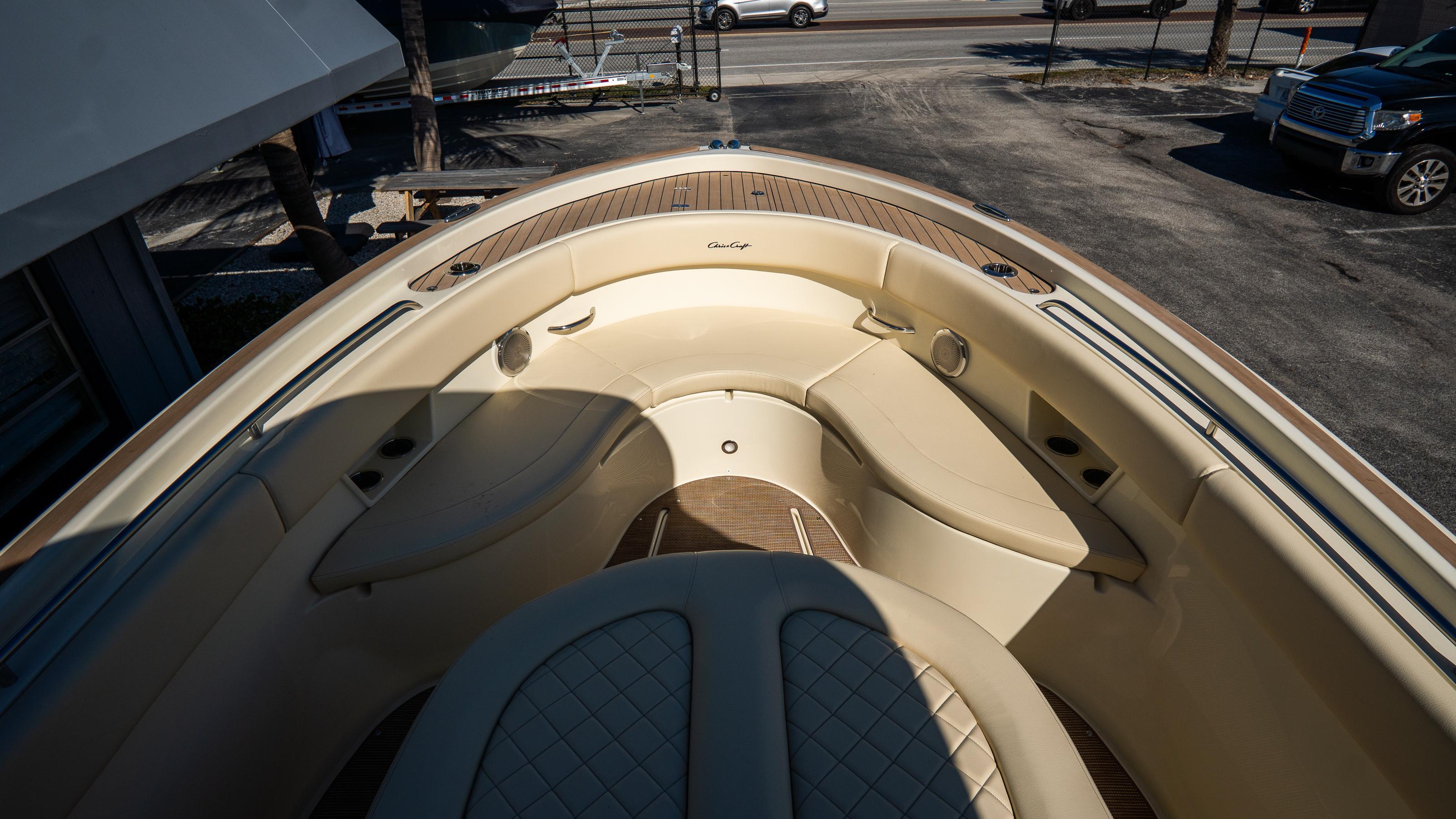 2025 Chris-Craft Catalina 30 boat interior with beige seating and wood accents.