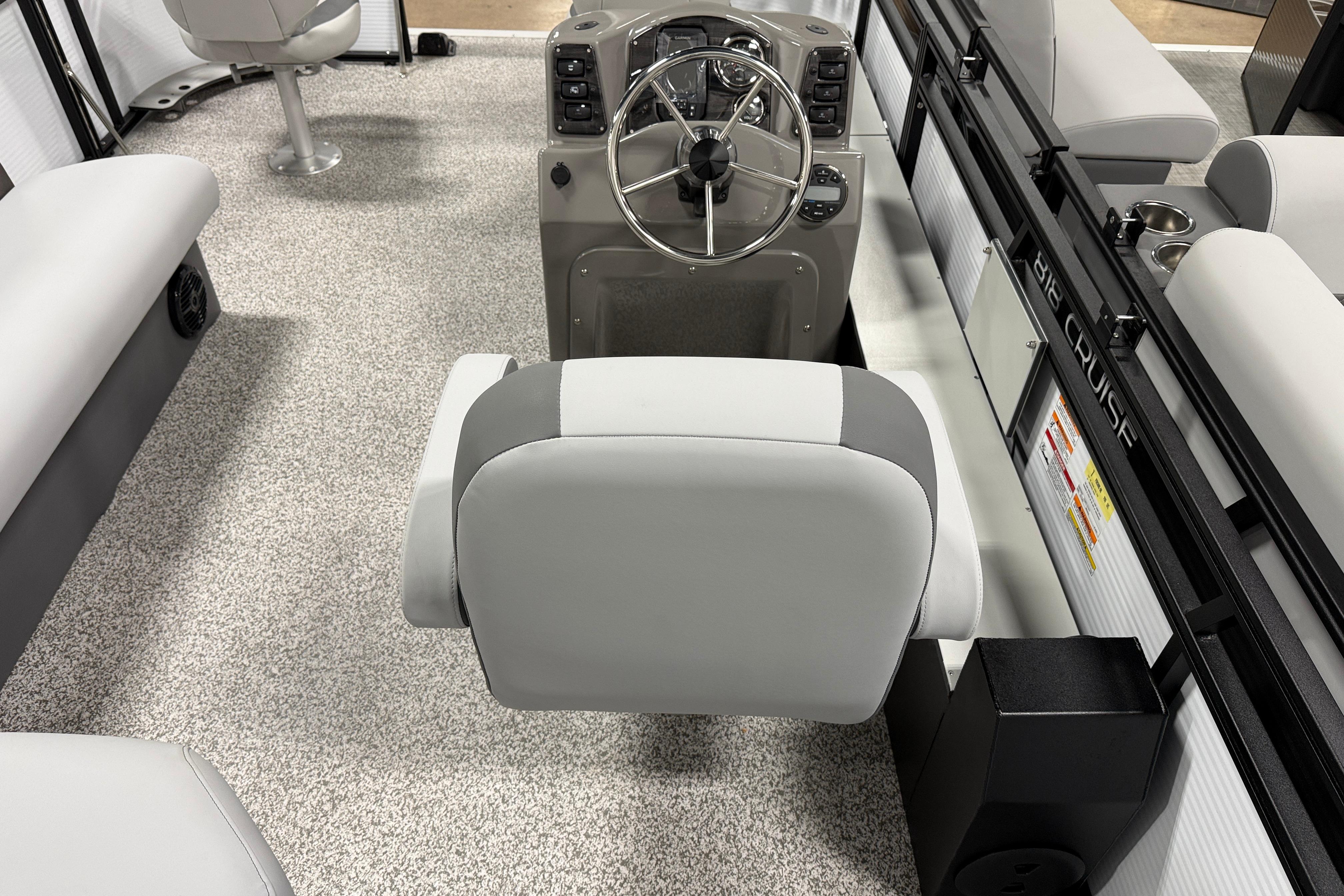 2026 Angler Quest 816 Panfish boat interior with steering console and seating.