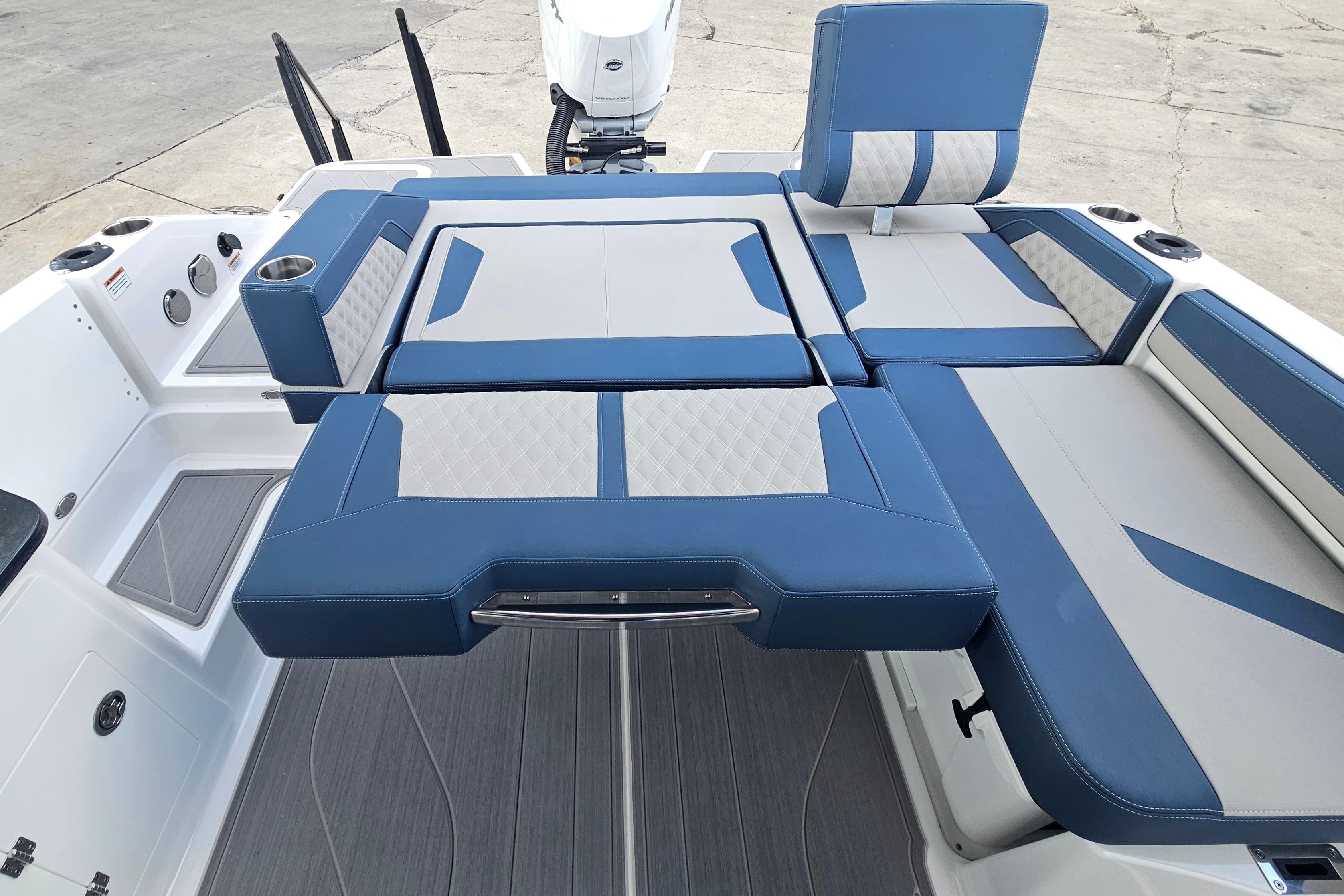 2026 Monterey Elite 27 OB boat interior with blue and gray seating arrangement.