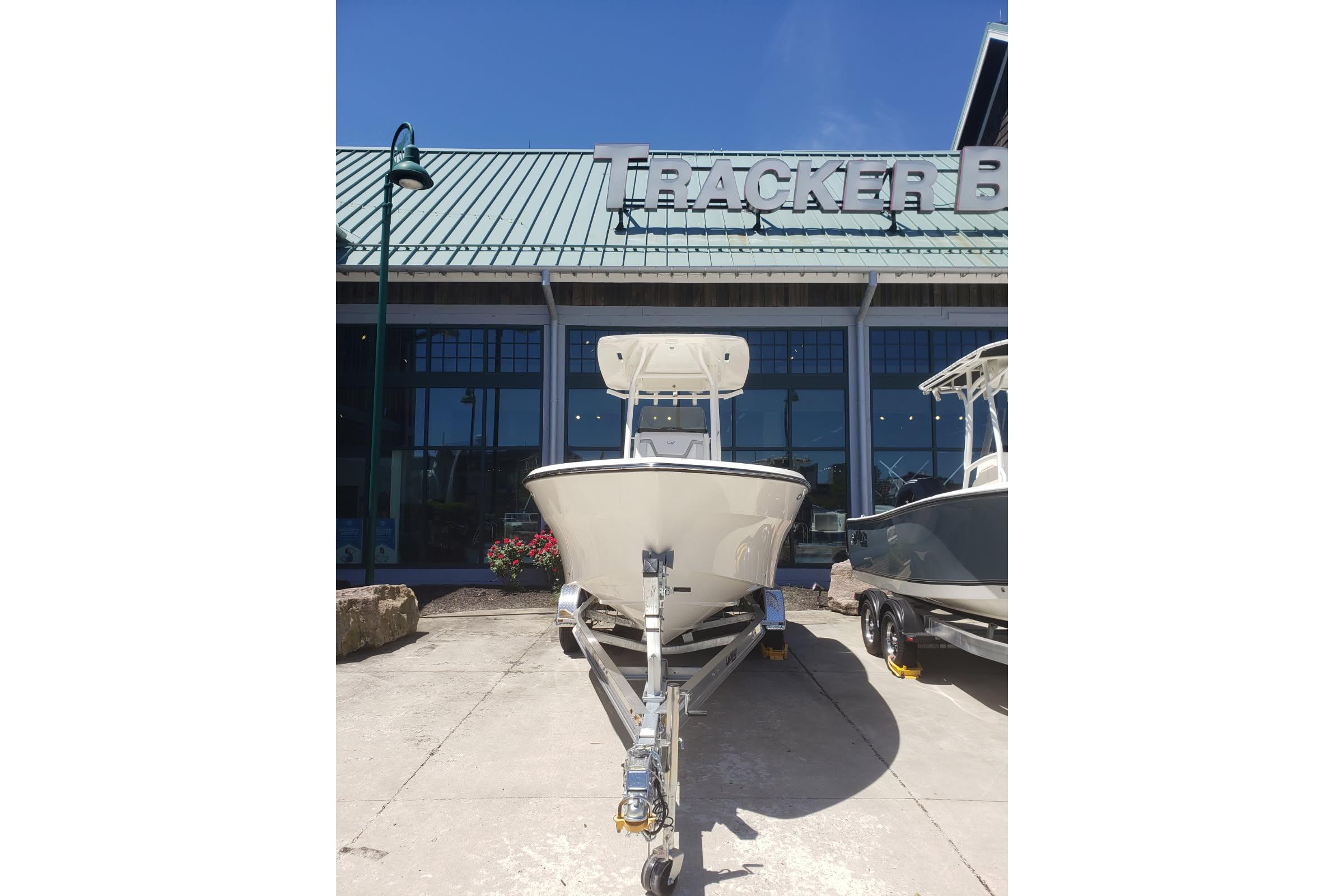 2026 Mako 226 Center Console boat on trailer outside Tracker Boats store.