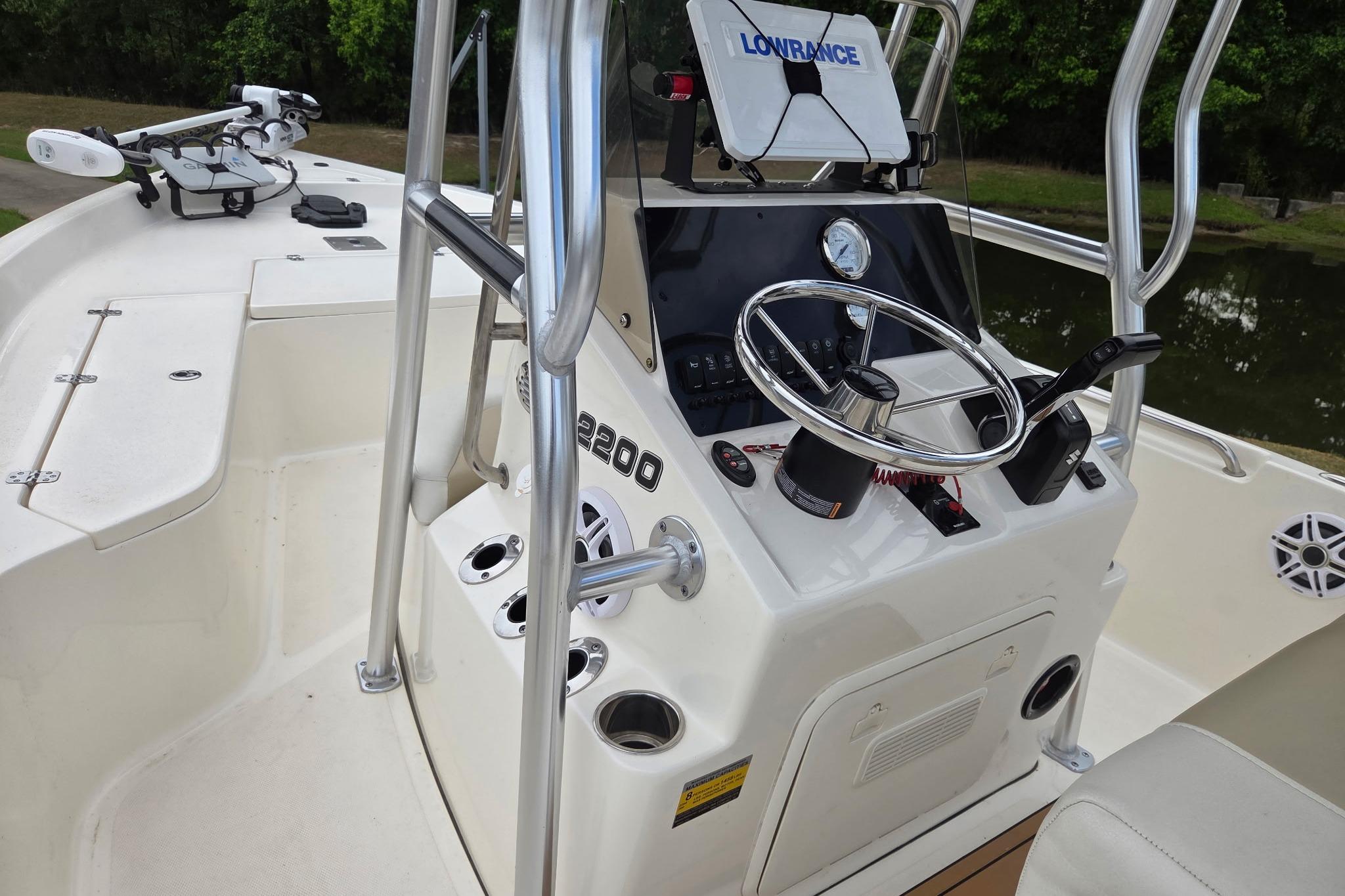 2023 Bulls Bay 2200 boat cockpit with steering wheel and control panel.