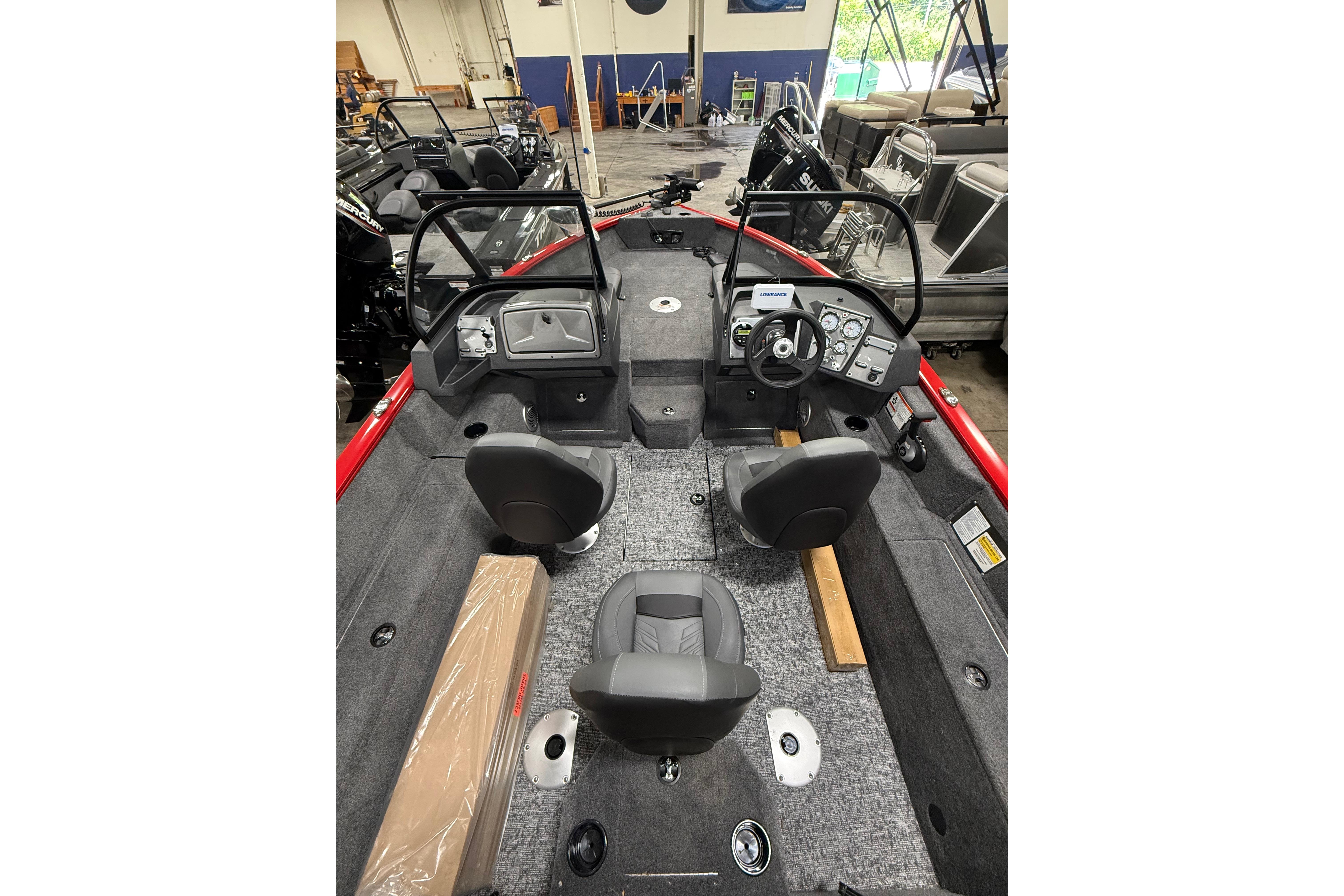 2026 Tracker Pro Guide V-175 Combo boat interior with seating and control panel.
