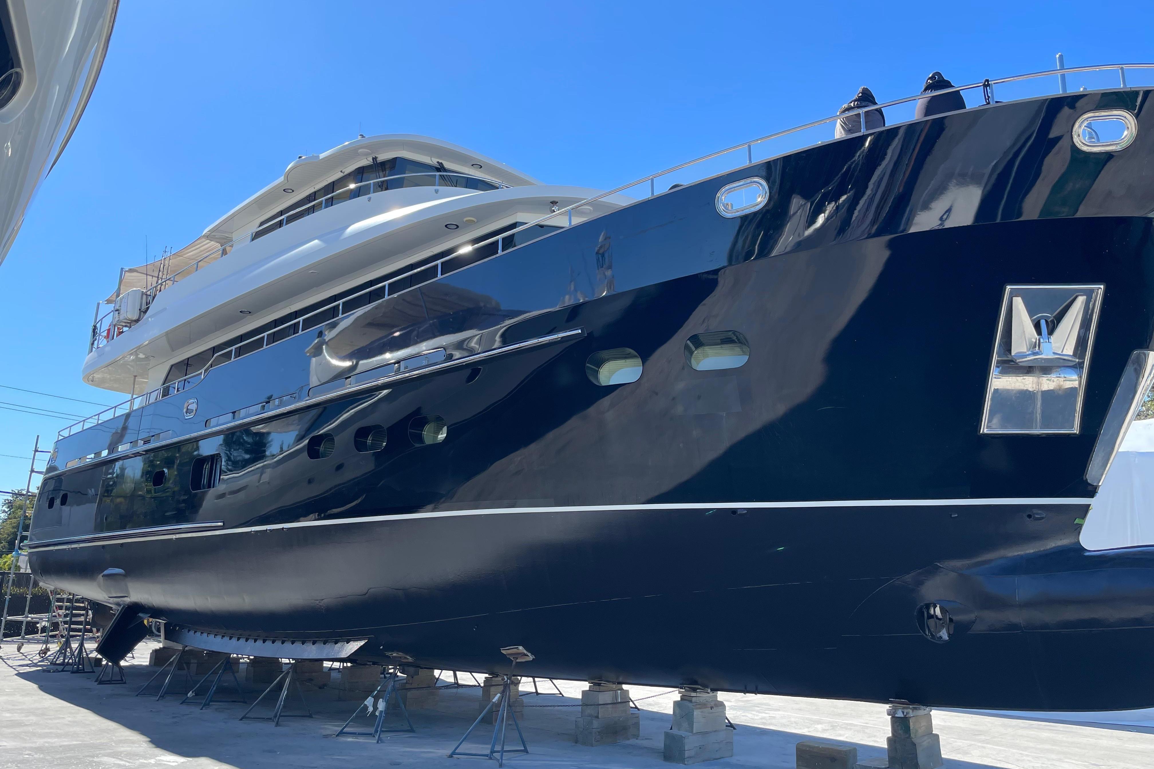 2014 Fifth Ocean Yachts 24m Displacement Explorer Yacht on dry dock, showcasing sleek design.