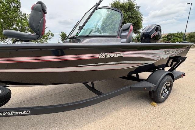 2026 Ranger VS1782SC Angler boat on trailer, sleek design, black with red accents.